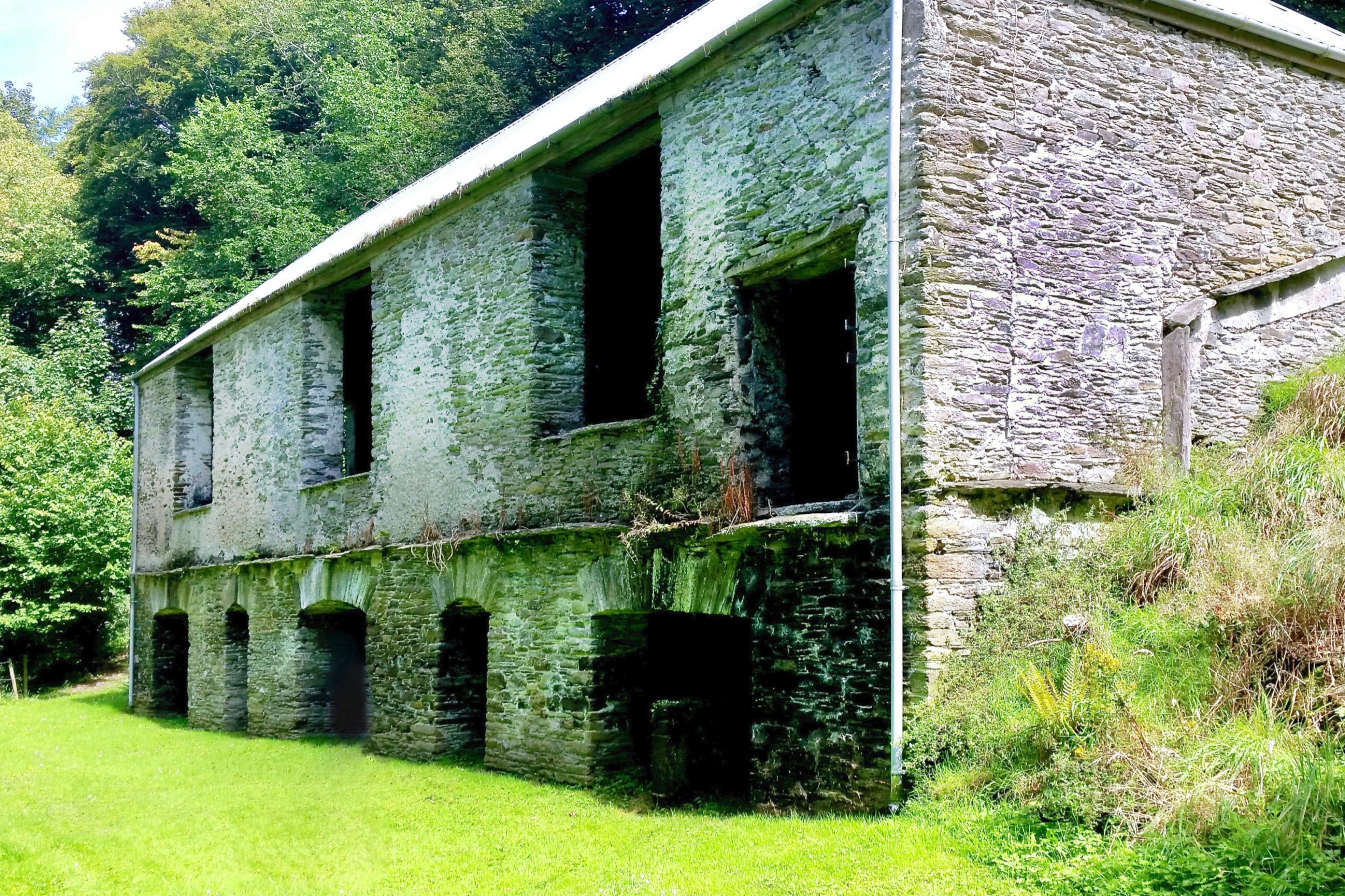 Abandoned stone barn acquired for conversion into a contemporary family home