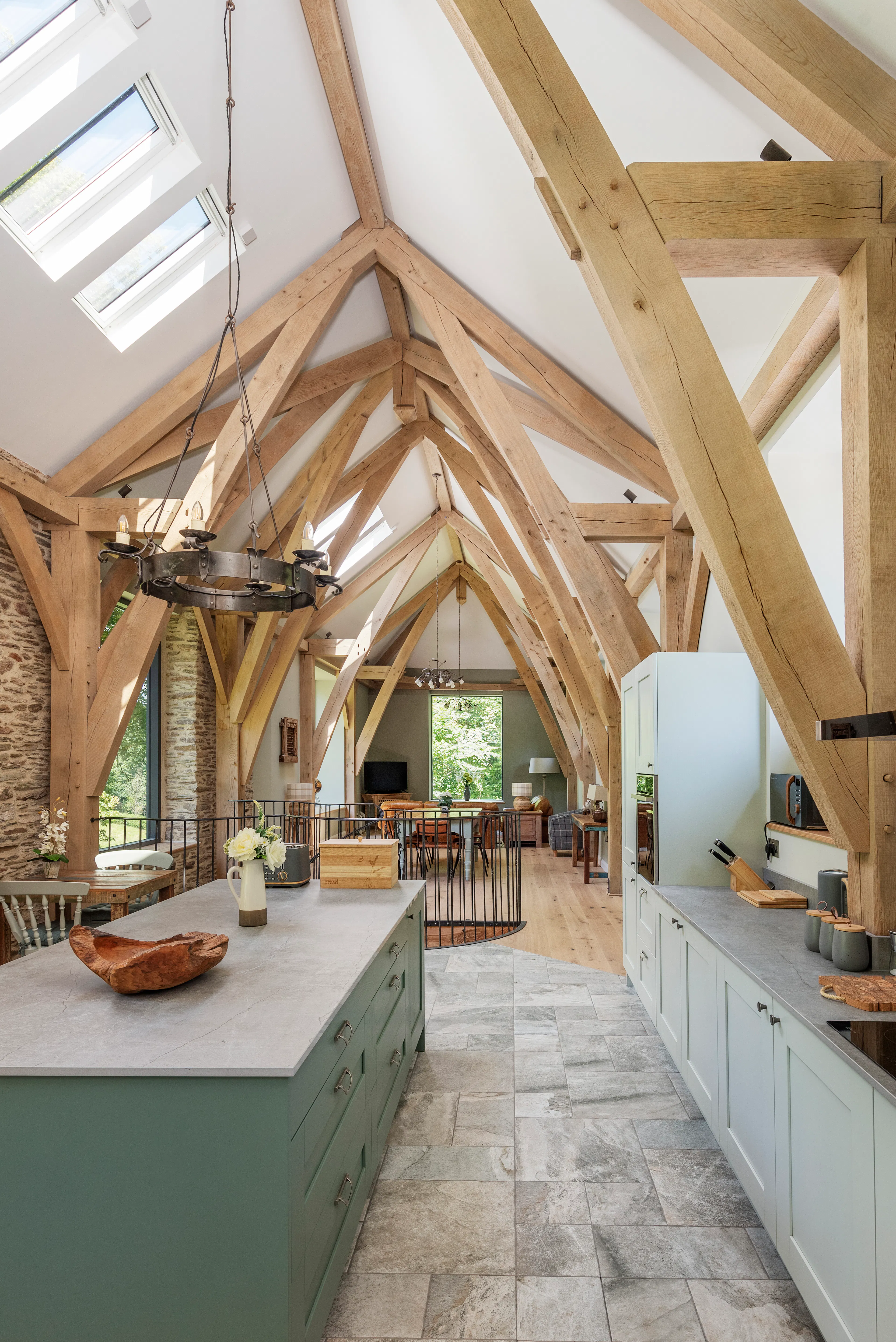 Open-plan living space showcasing a structural oak fram