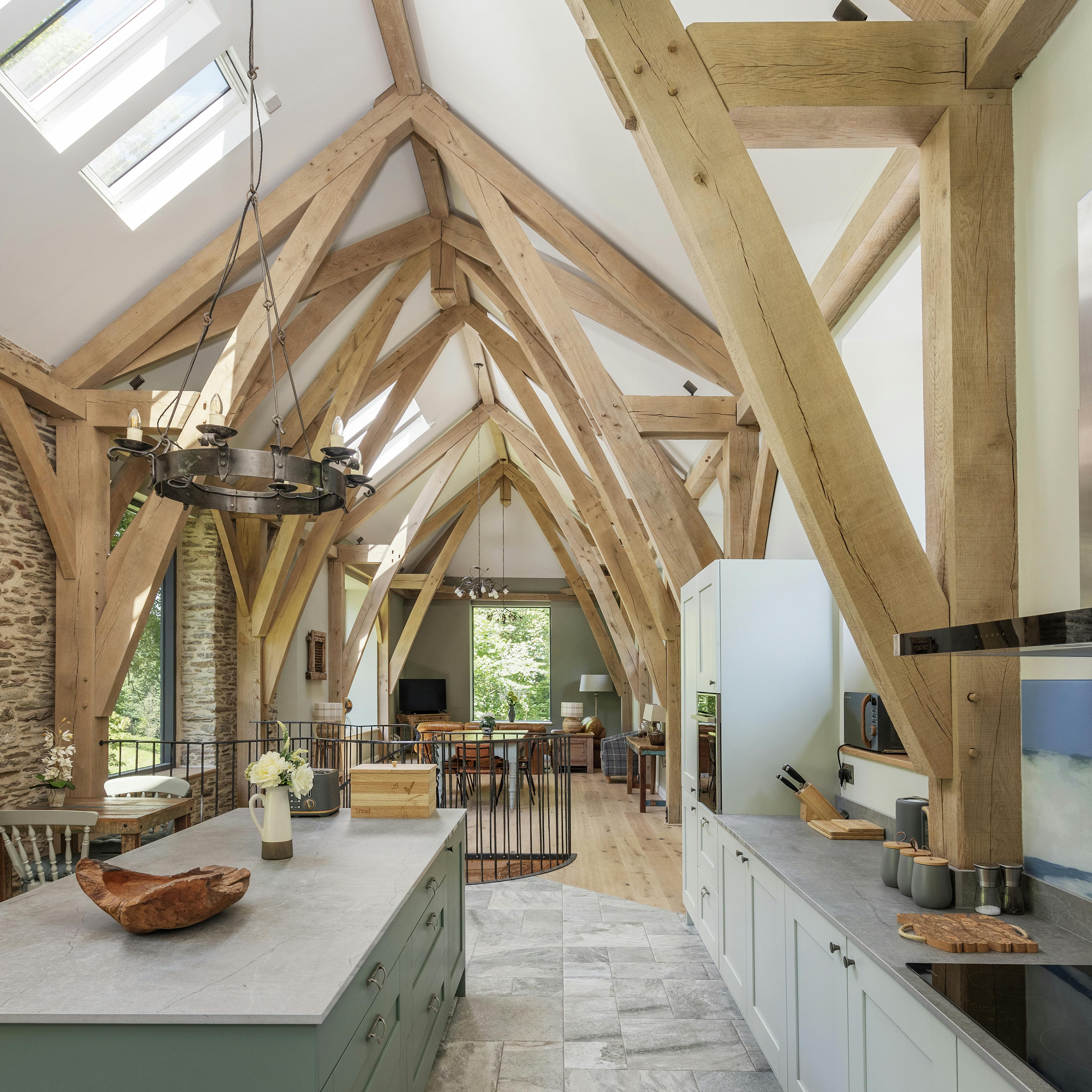 Open-plan living space showcasing a structural oak fram