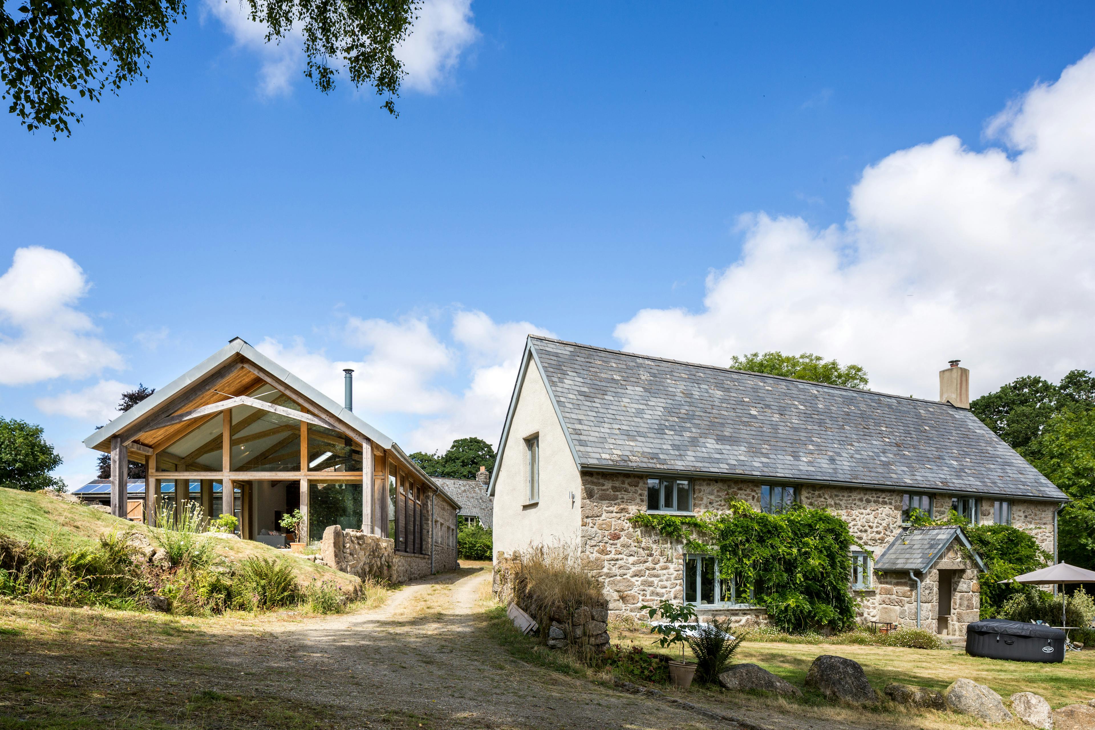 Exterior view of a newly built self-contained annex adjacent to an existing farmhouse cottage