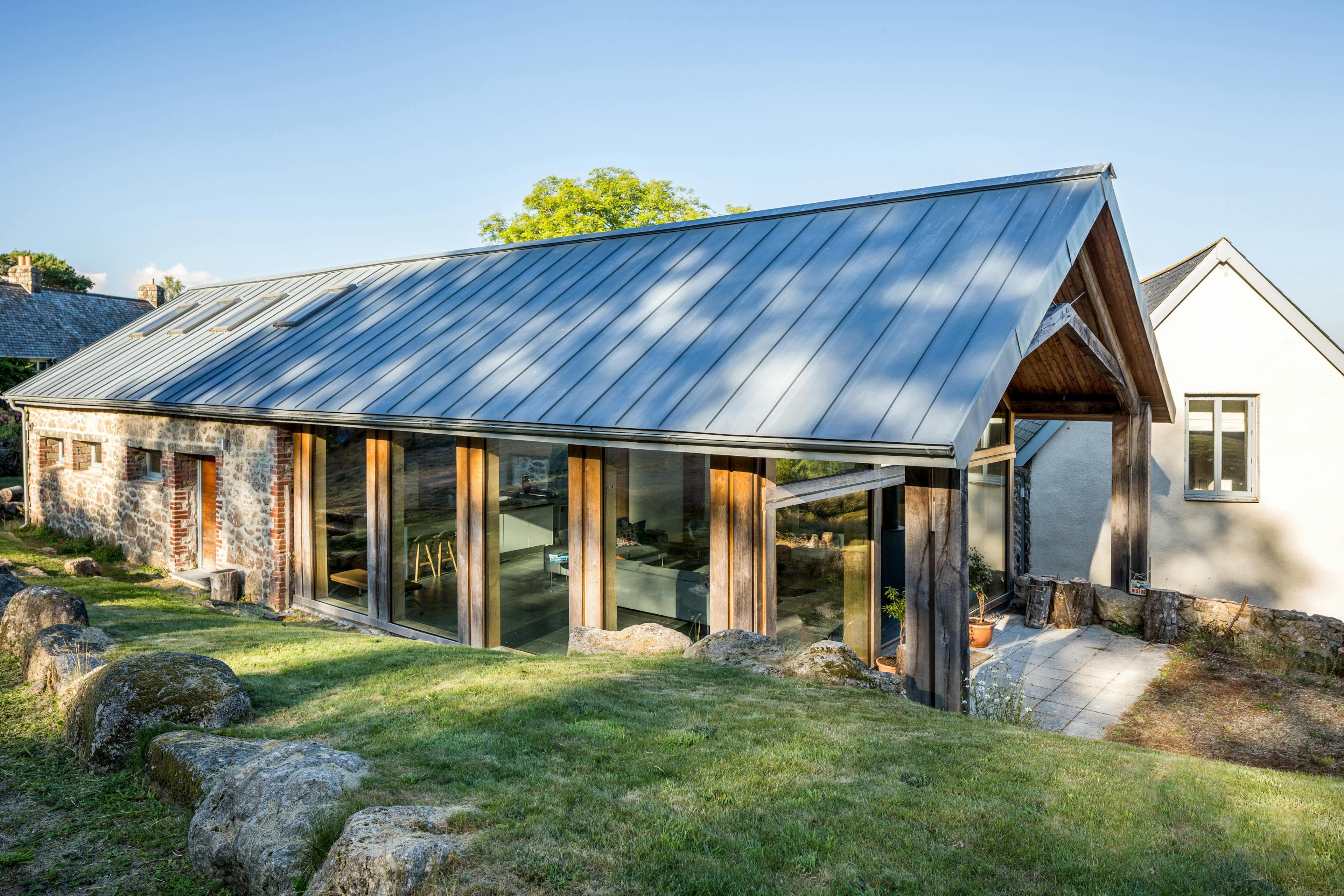 Exterior view of a contemporary annex showcasing a structural oak frame