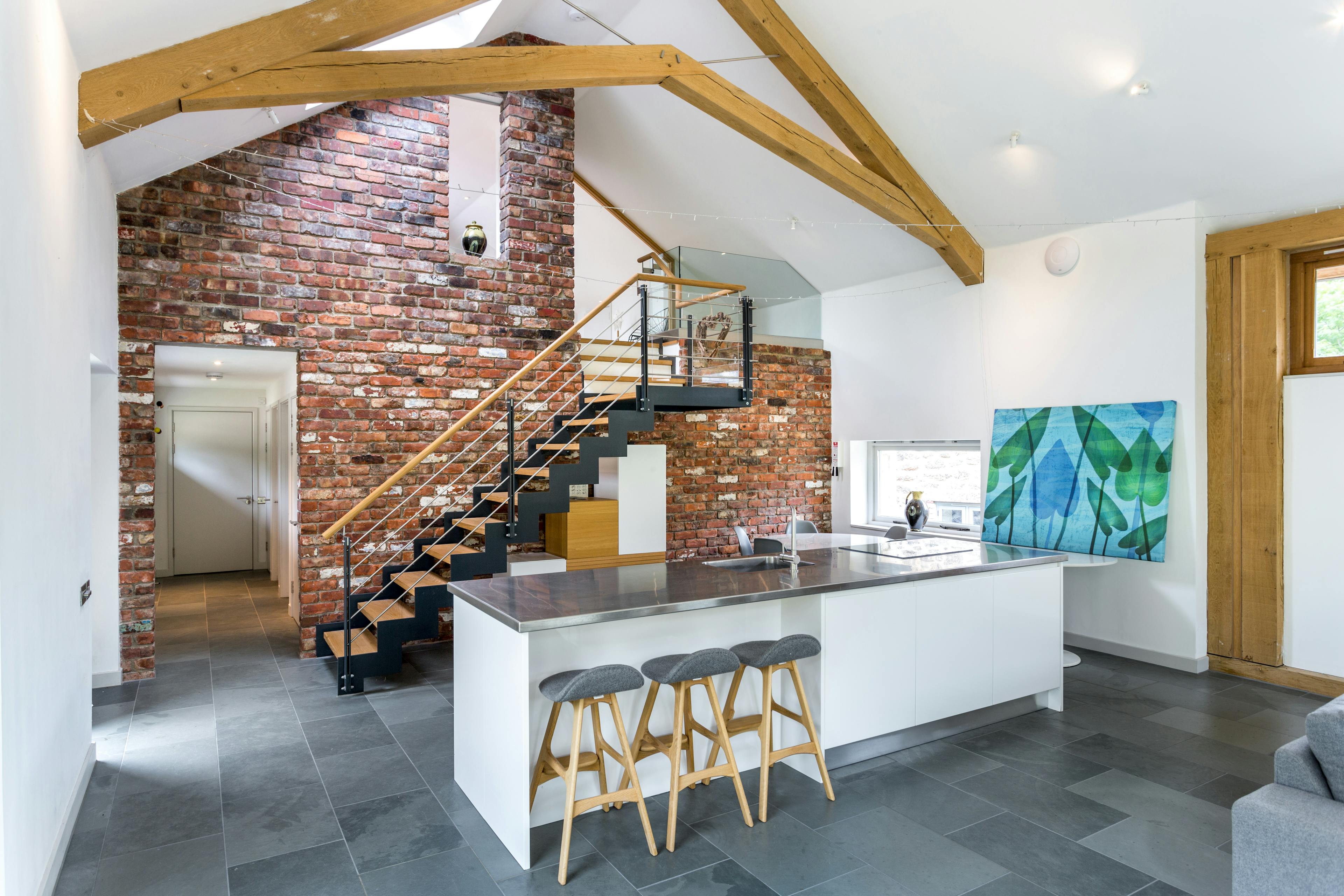 An oak framed living room and kitchen extension with scissor truss