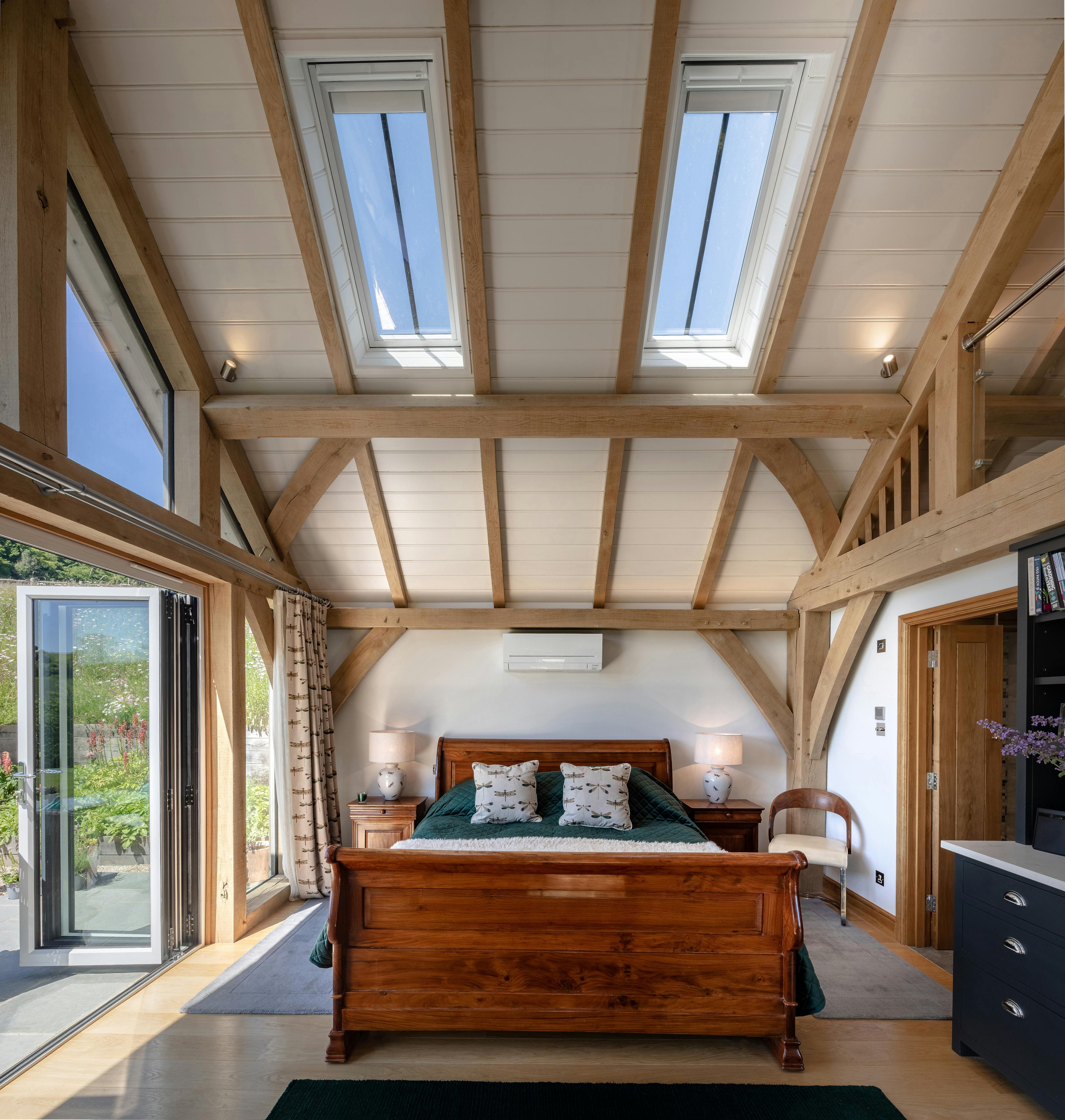 The bedroom area inside an oak framed garden annex