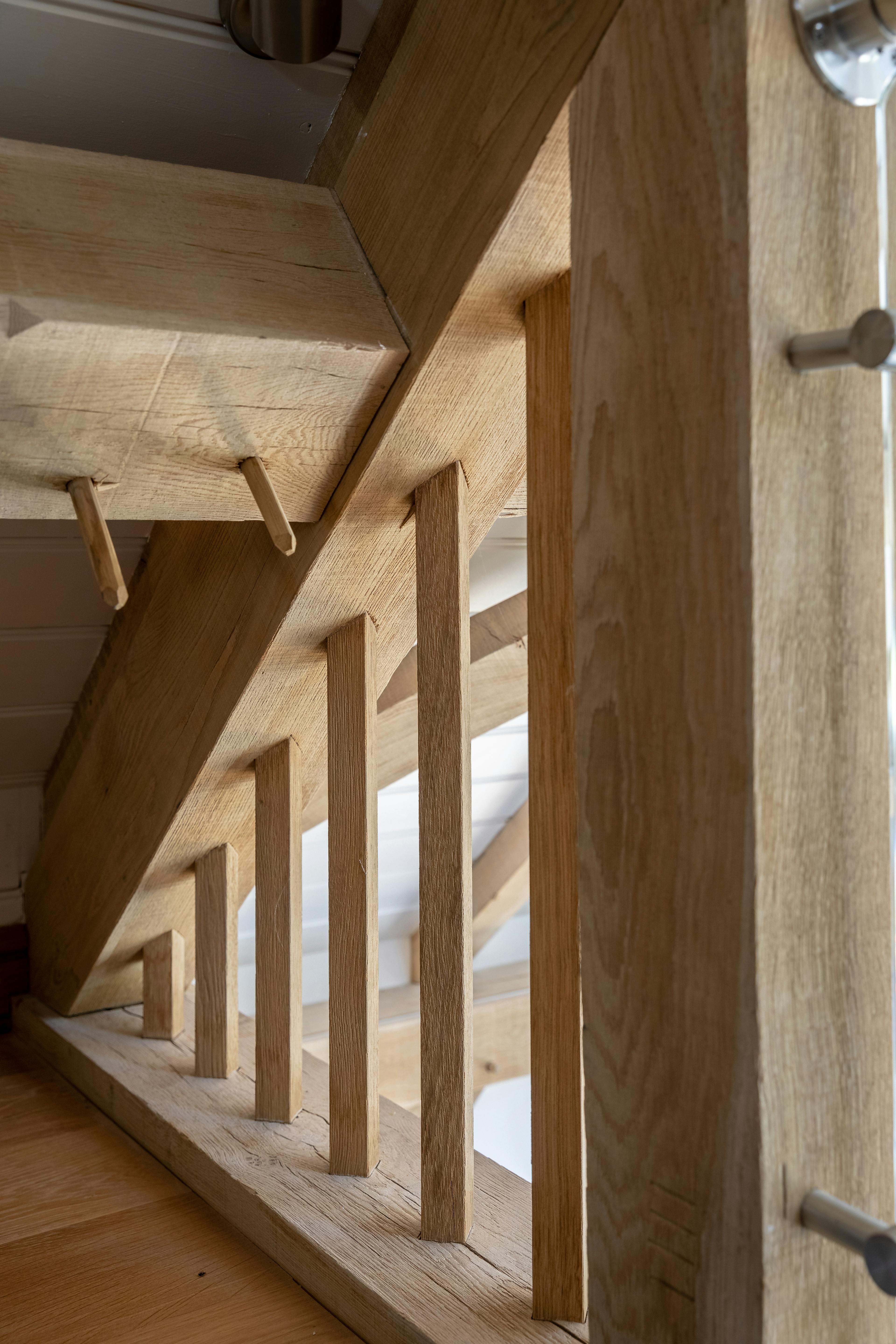 A detail of the mezzanine area inside an oak framed garden annex
