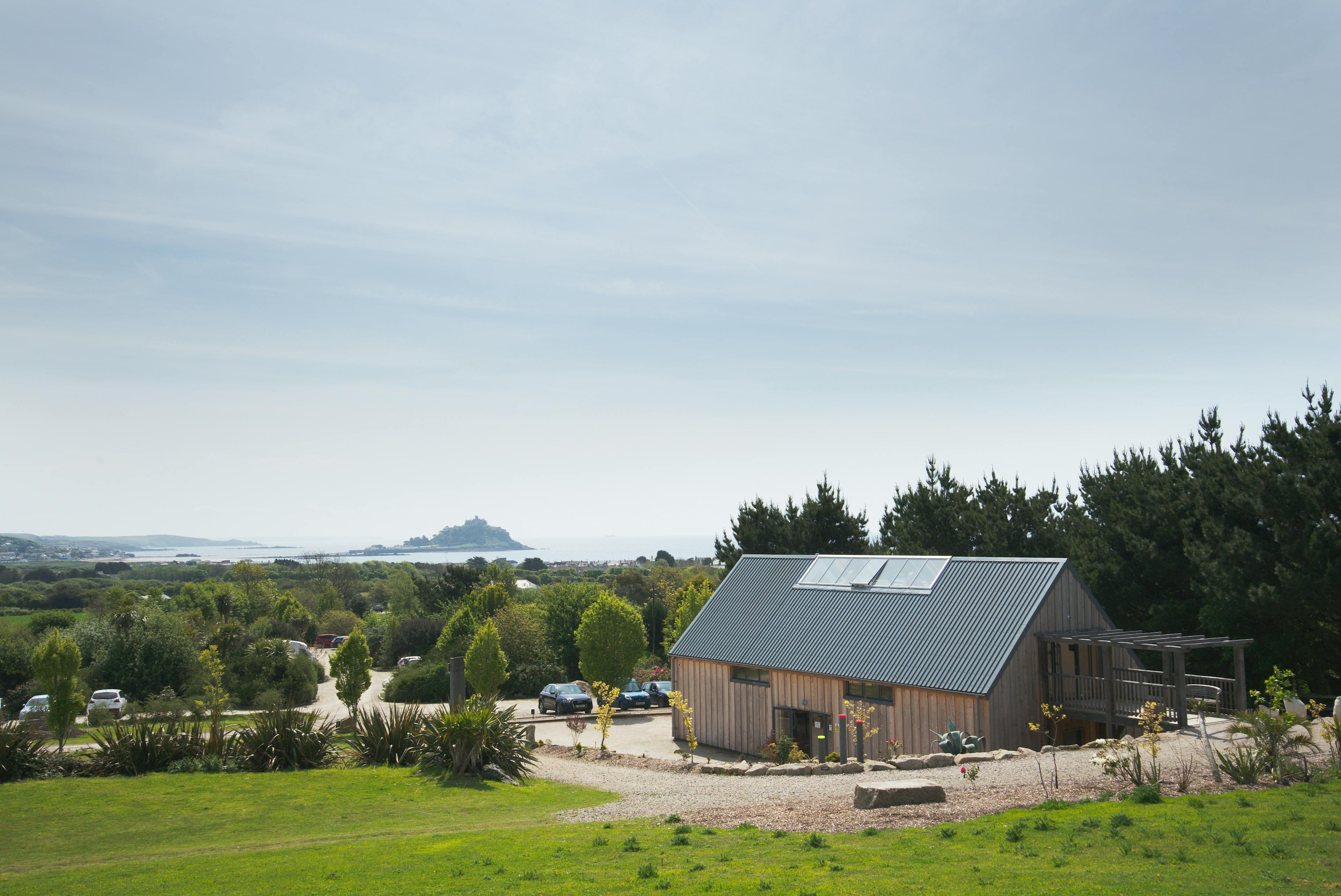 Exterior view of a contemporary art gallery, showcasing an internal structural oak frame