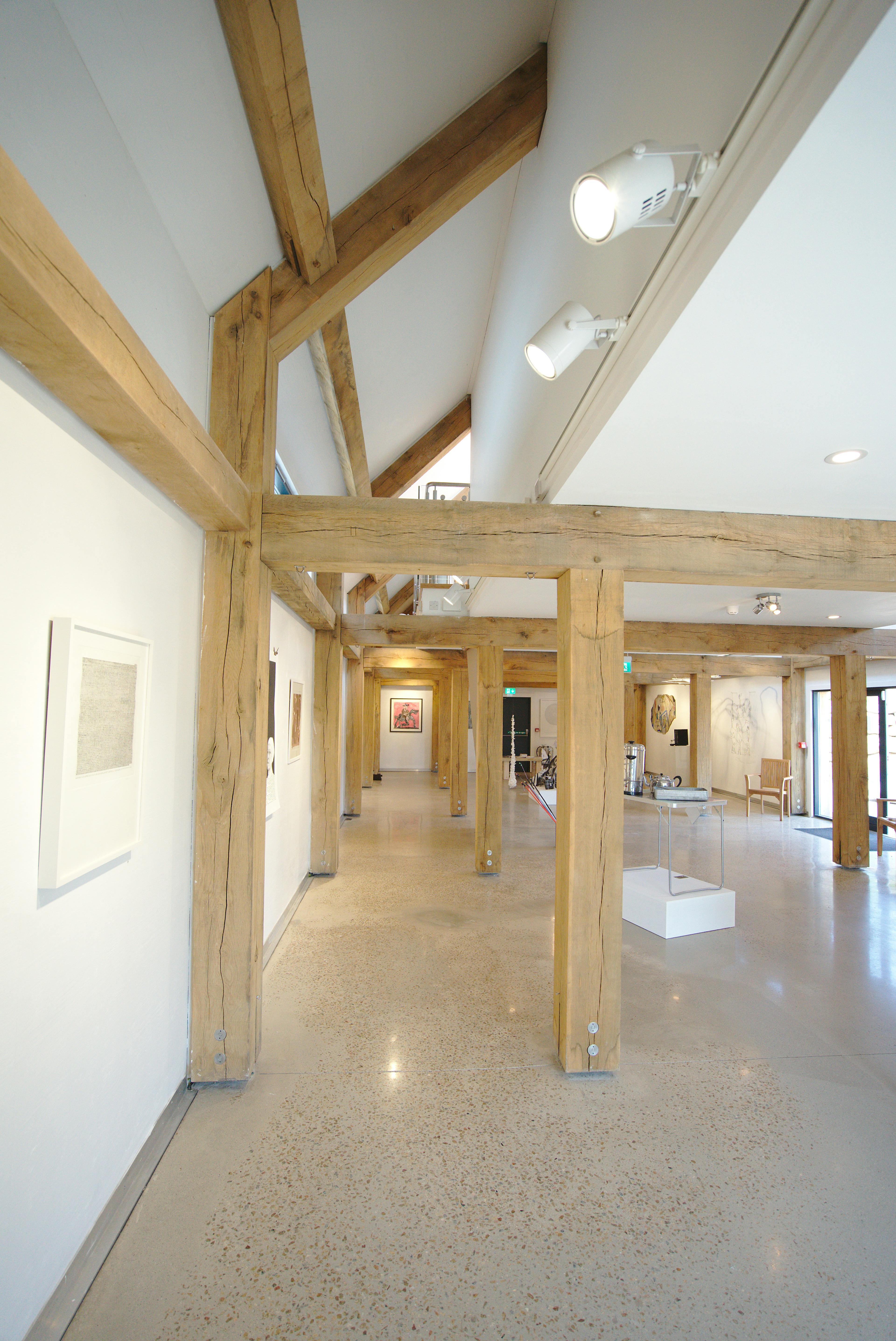 Contemporary art gallery featuring a structural oak frame