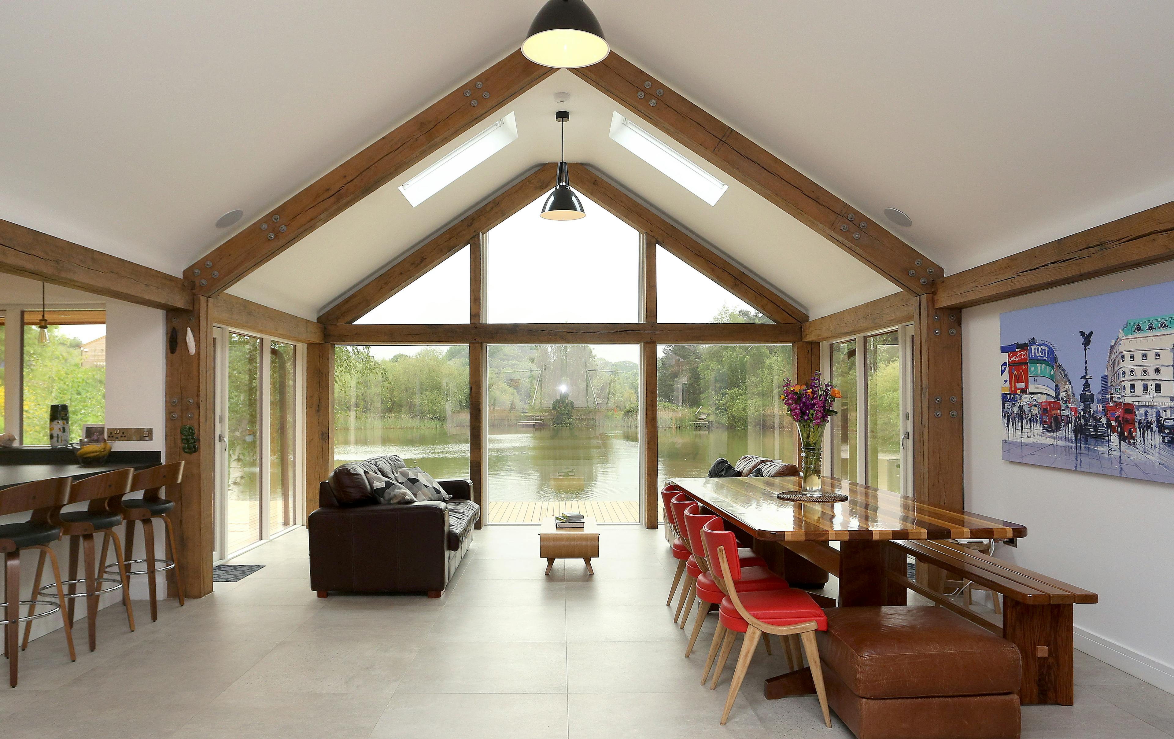 An open plan living area with a timber portal frame