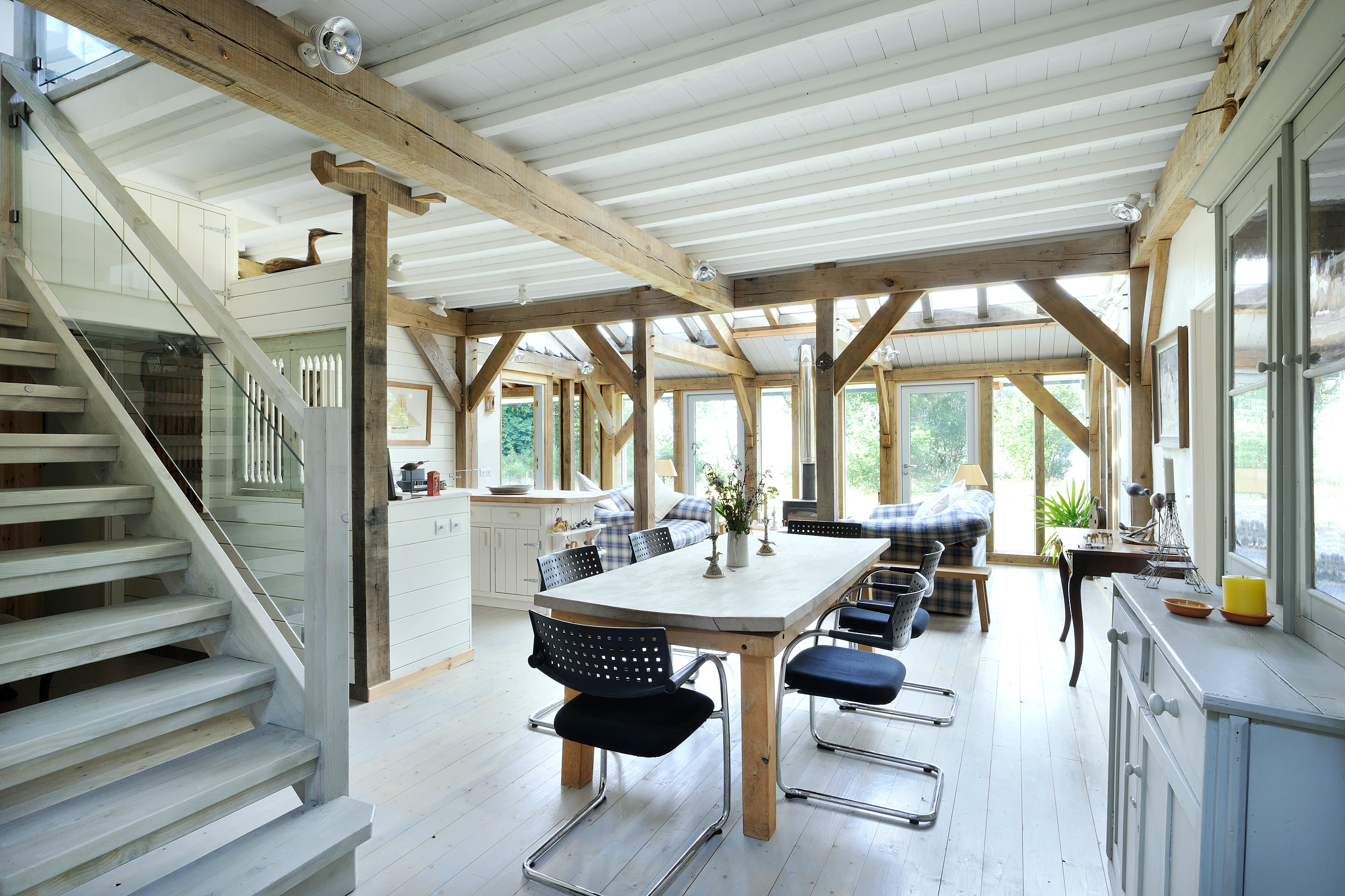 Interior view of an oak-framed open-plan kitchen and dining room
