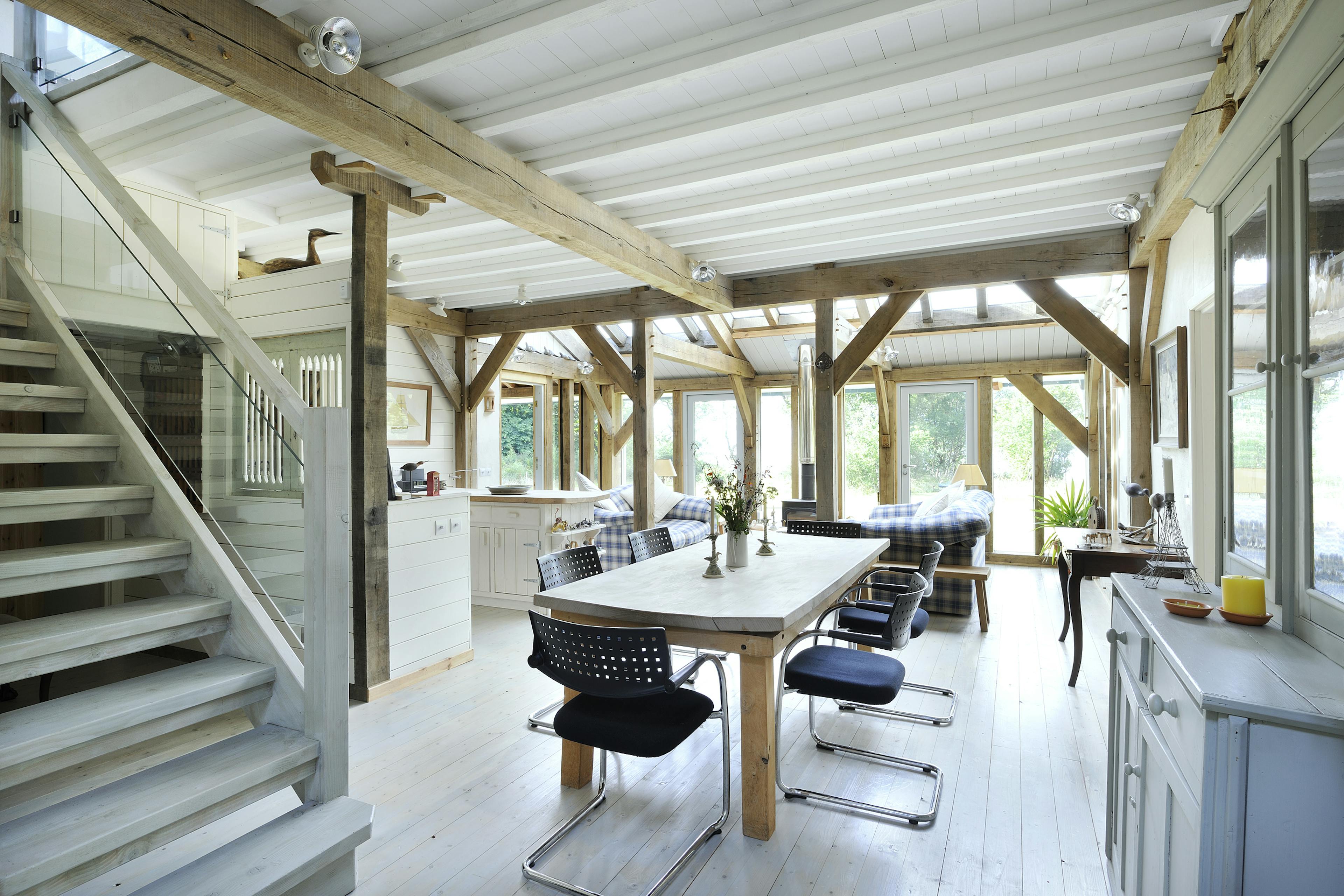 Interior view of an oak-framed open-plan kitchen and dining room