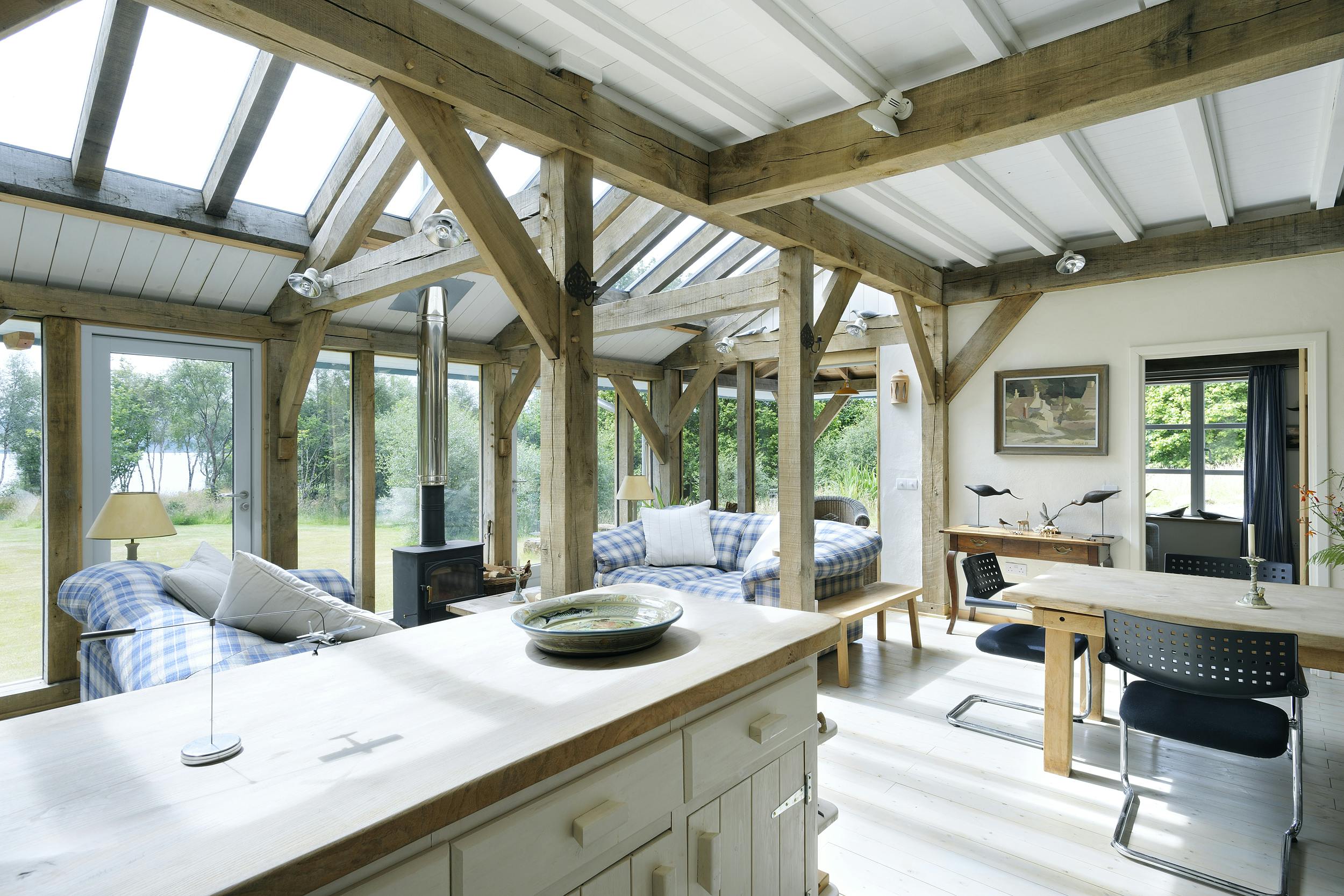 A light filled oak framed open plan living area with kitchen, dining space and sitting area