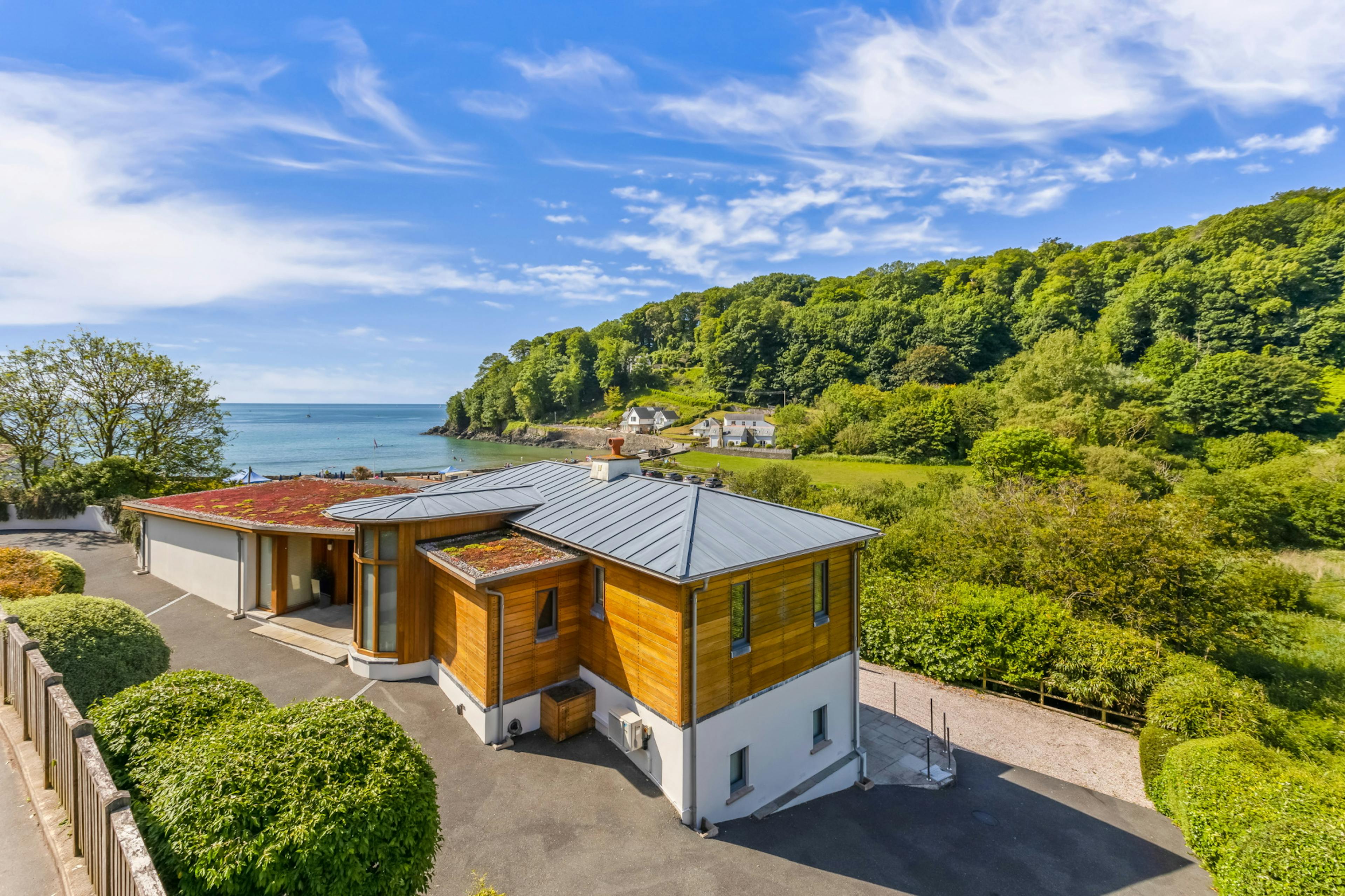 A two storey timber clad contemporary home with sea views