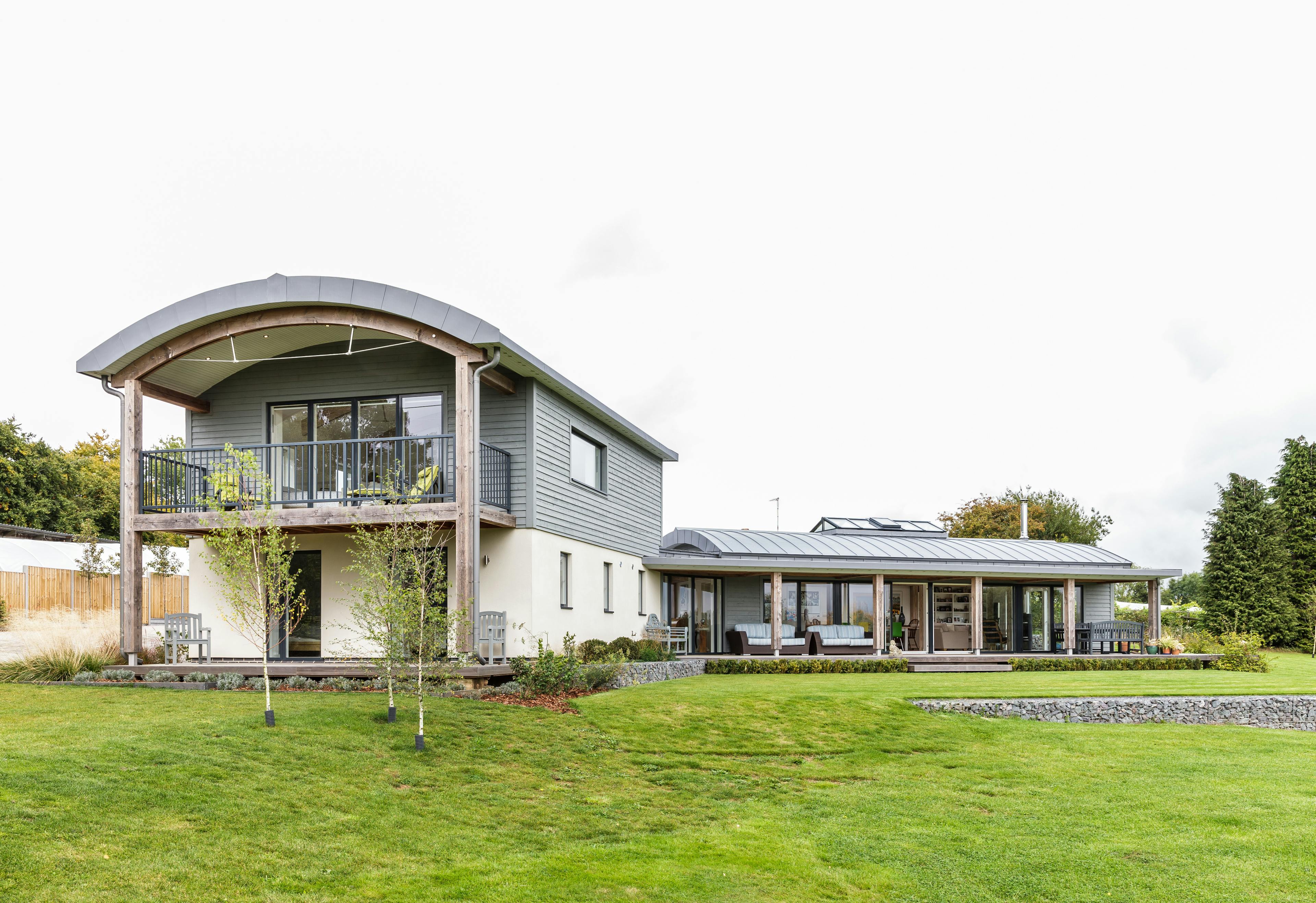Exterior view of a contemporary family home with a structural timber frame made of Douglas fir
