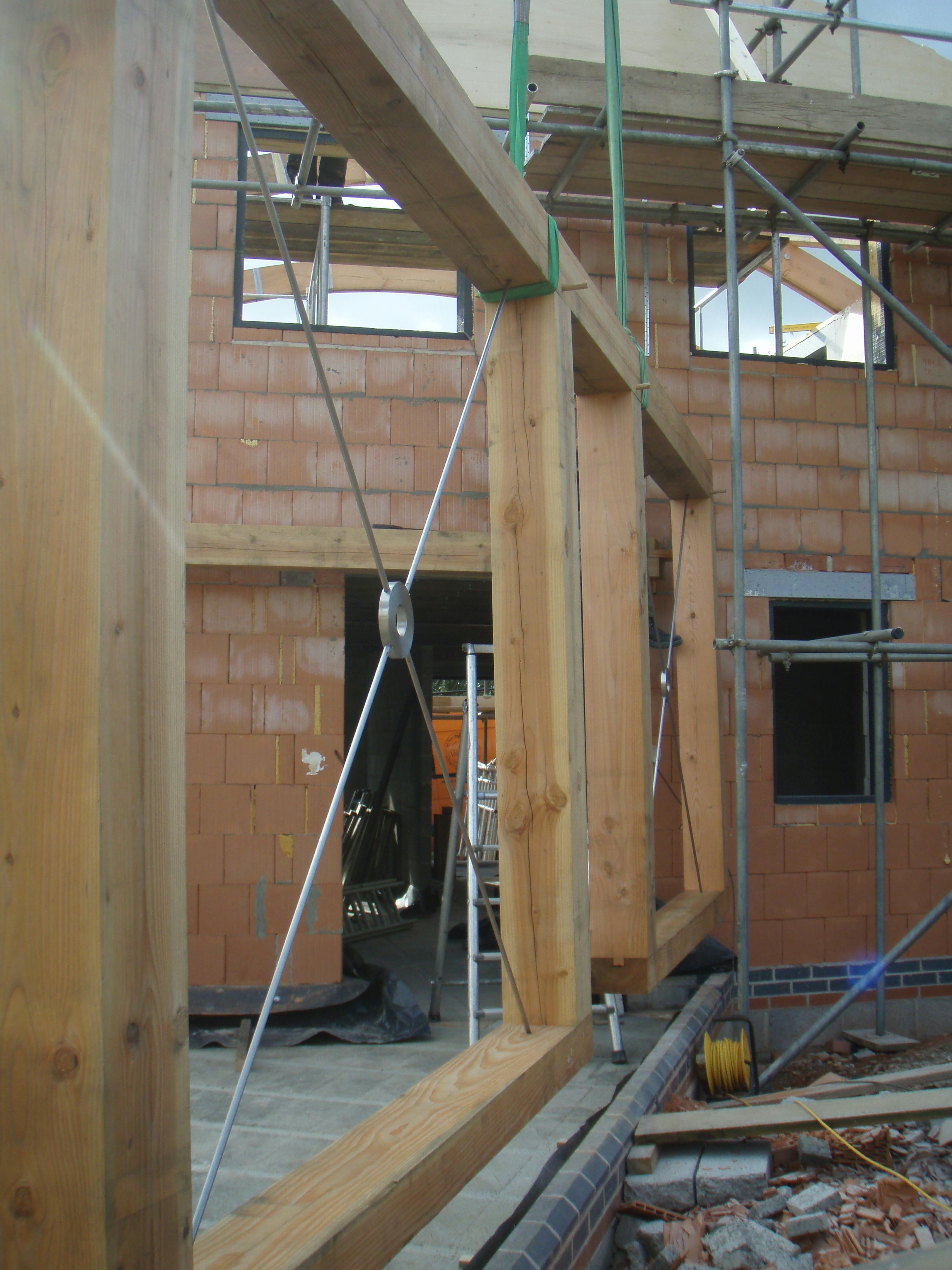 Close-up image of steel connections secured within a Douglas fir frame