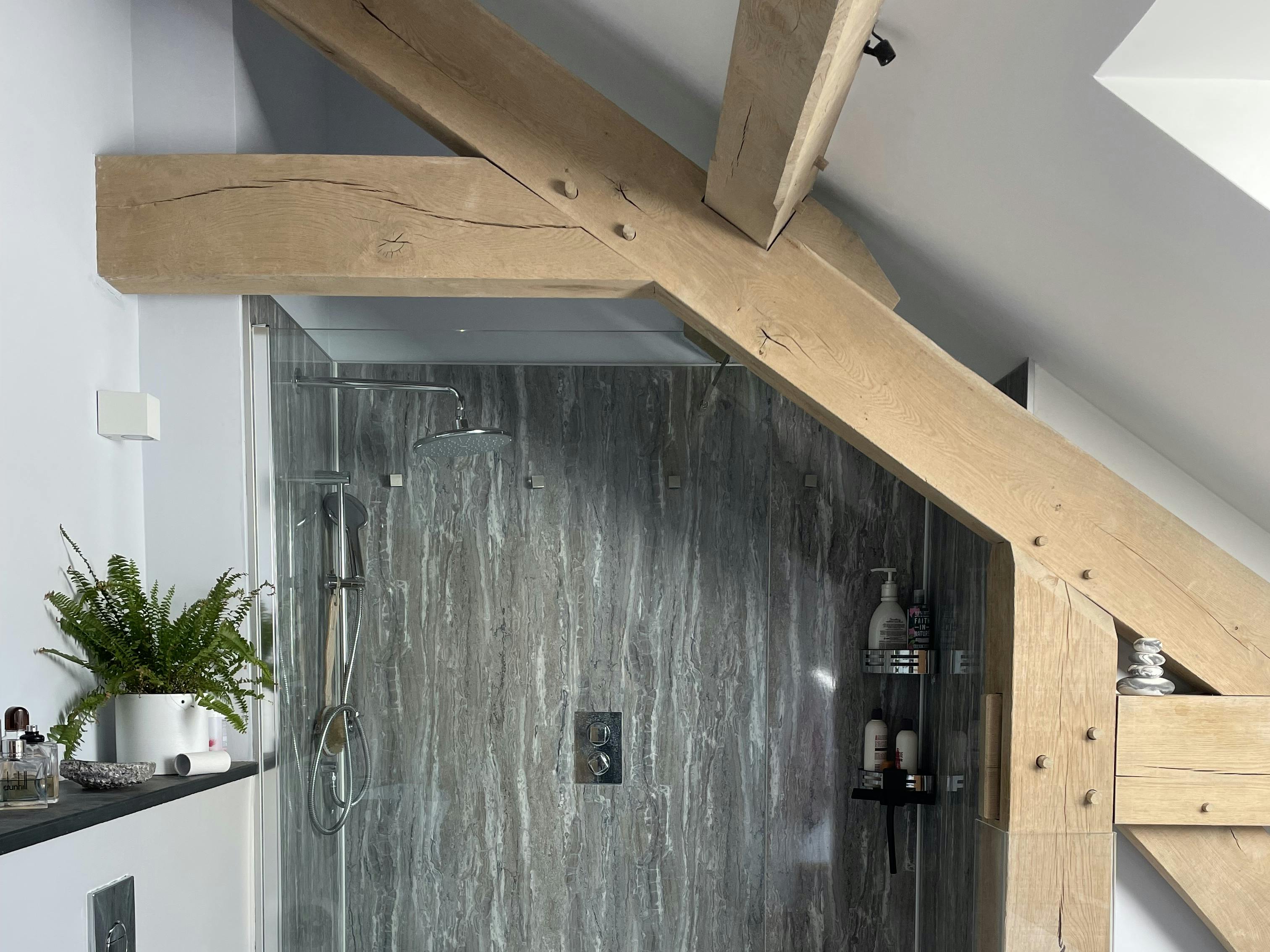 An oak framed interrupted tie beam in a bathroom