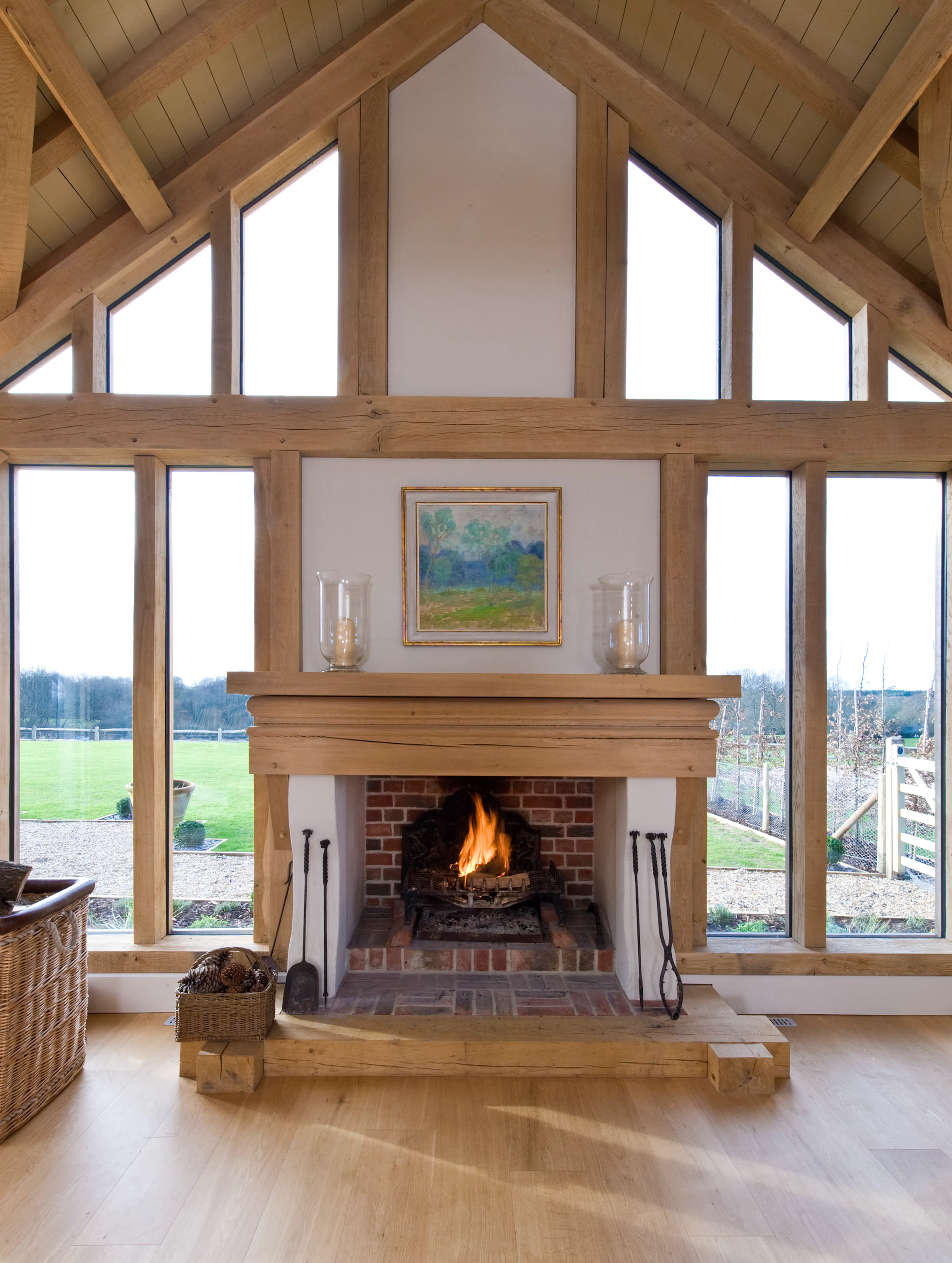 Fireplace in the sitting room lounge of an expansive oak-framed family home 