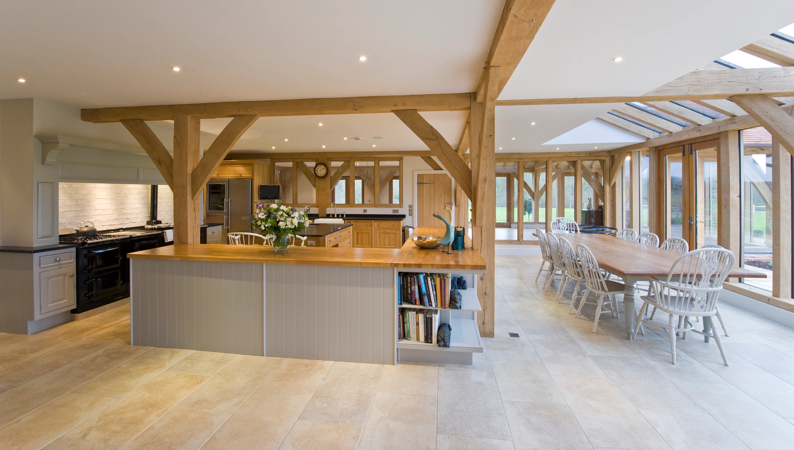 Oak-framed open-plan living space featuring a kitchen and dining area