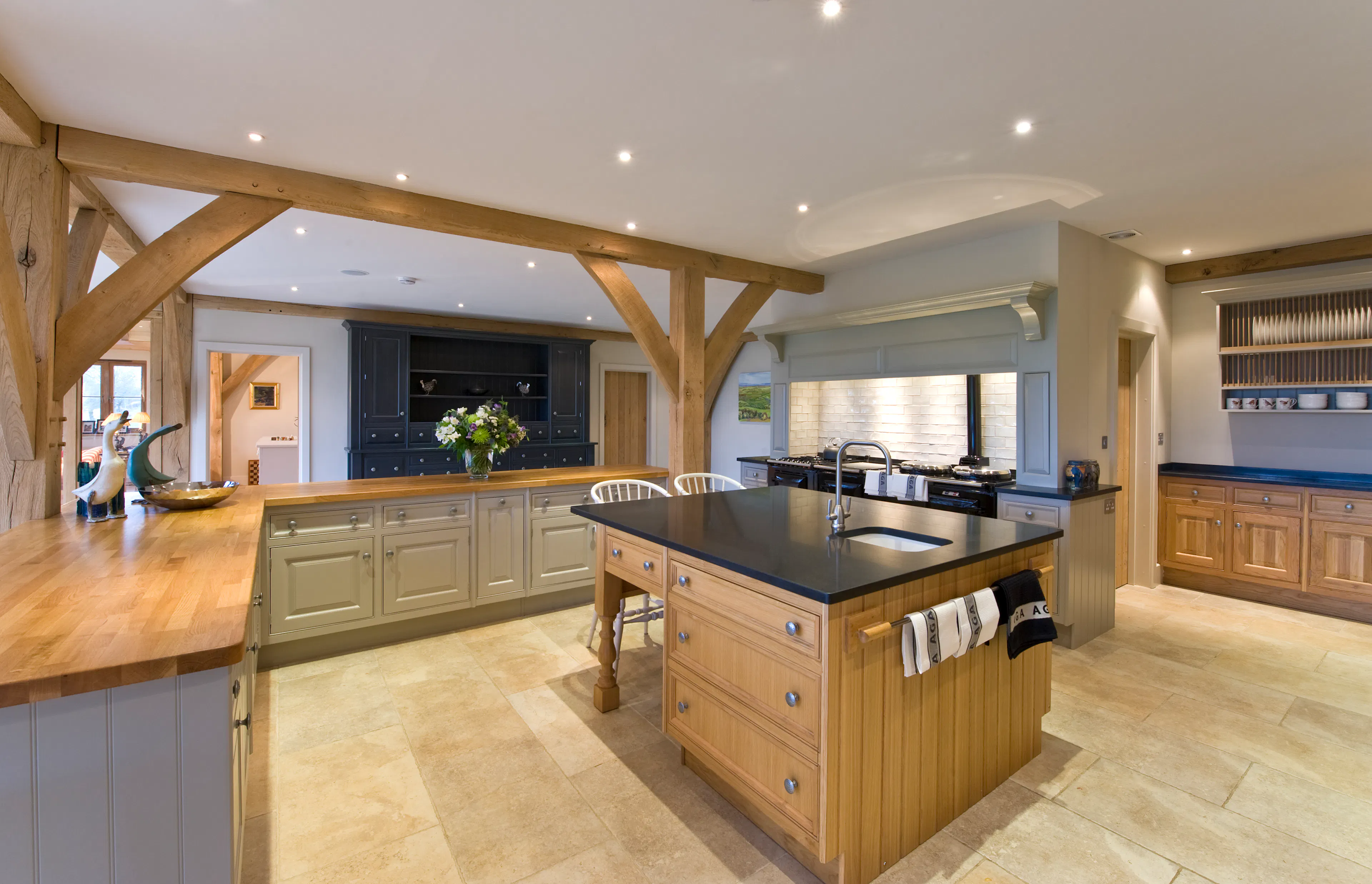 Oak-framed open-plan living space featuring a kitchen and dining area