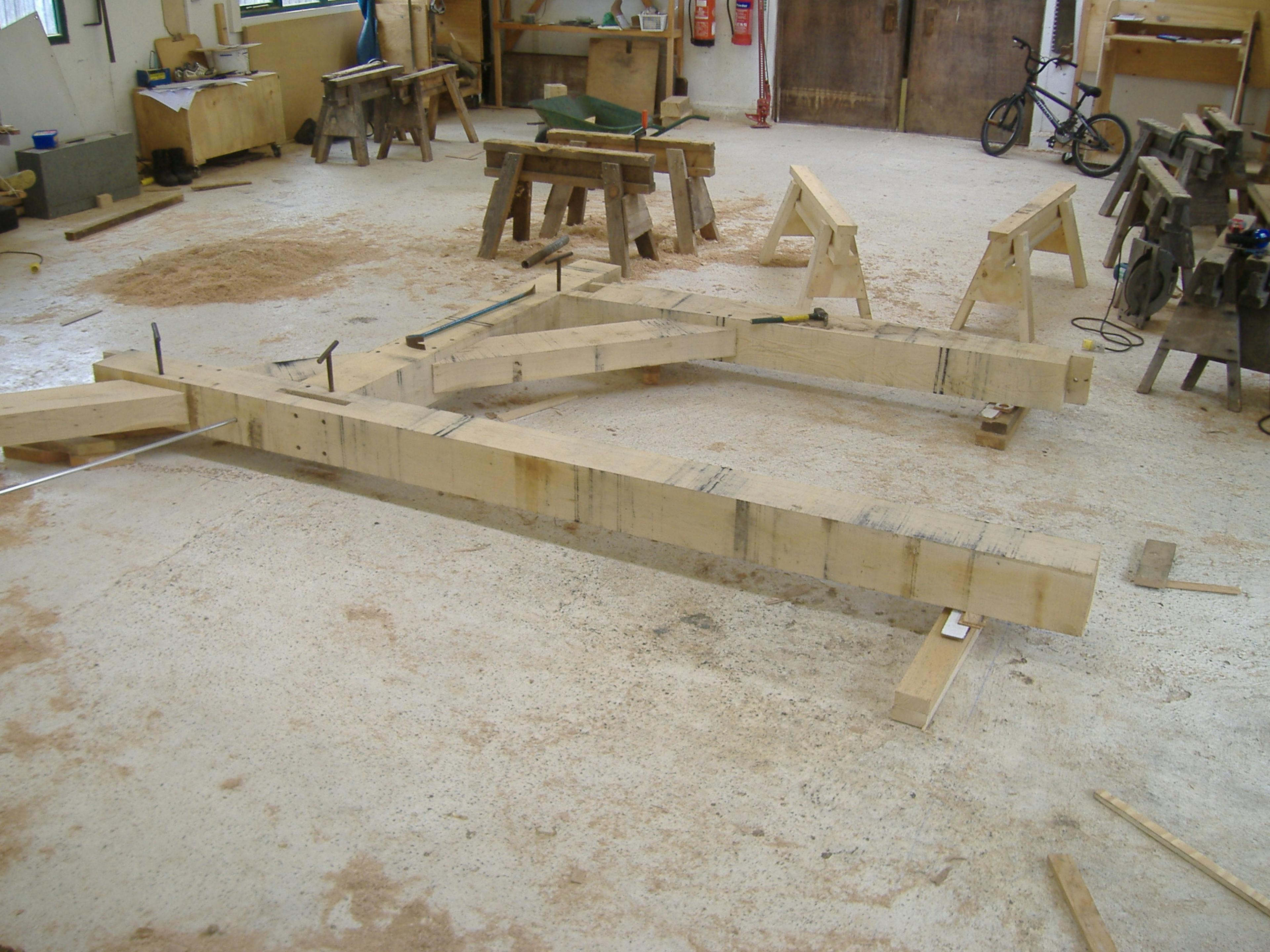 Timber sections being cut for a large-scale oak-framed family home in the workshop