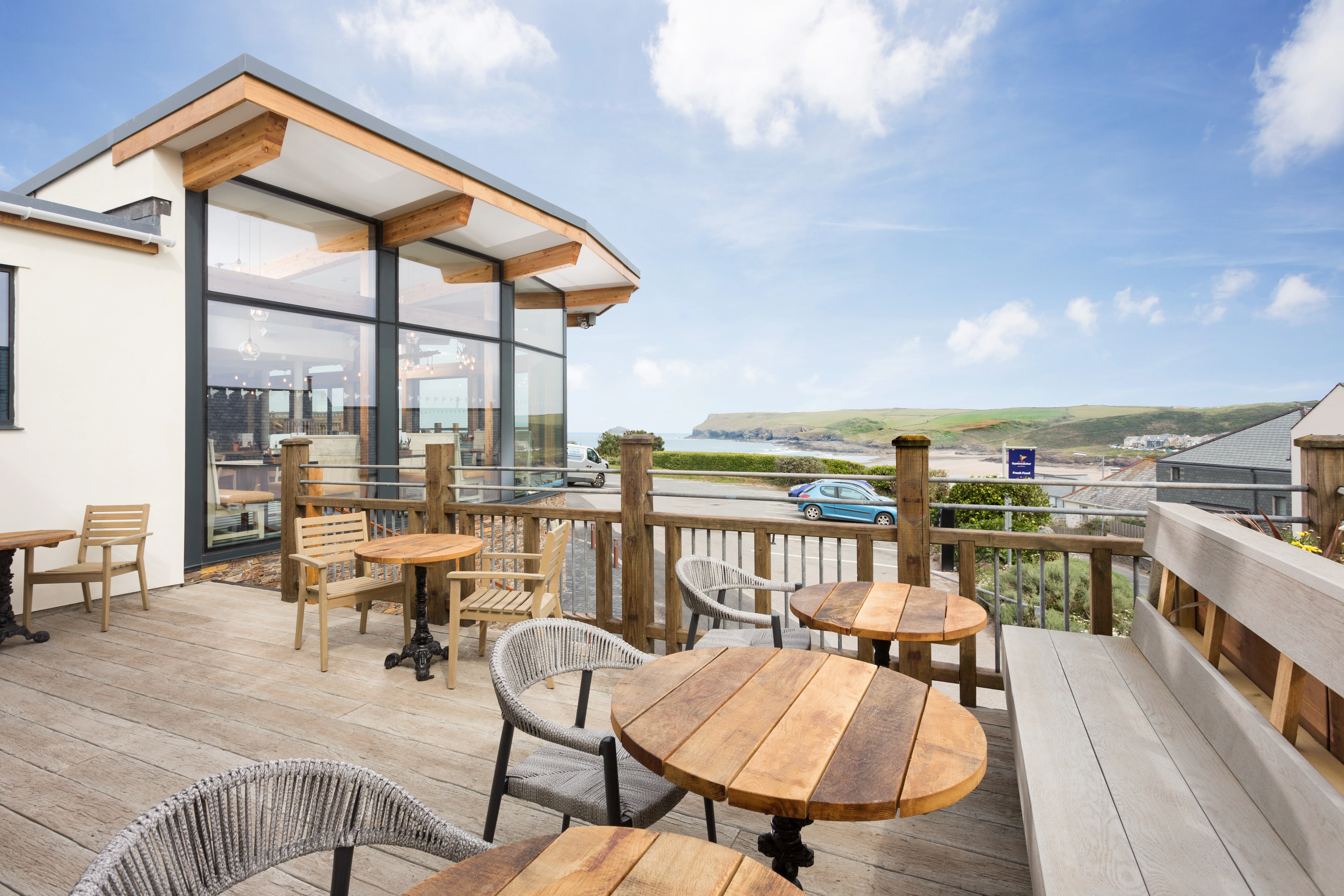 The terrace of a larch glulam bar and restaurant with sea views