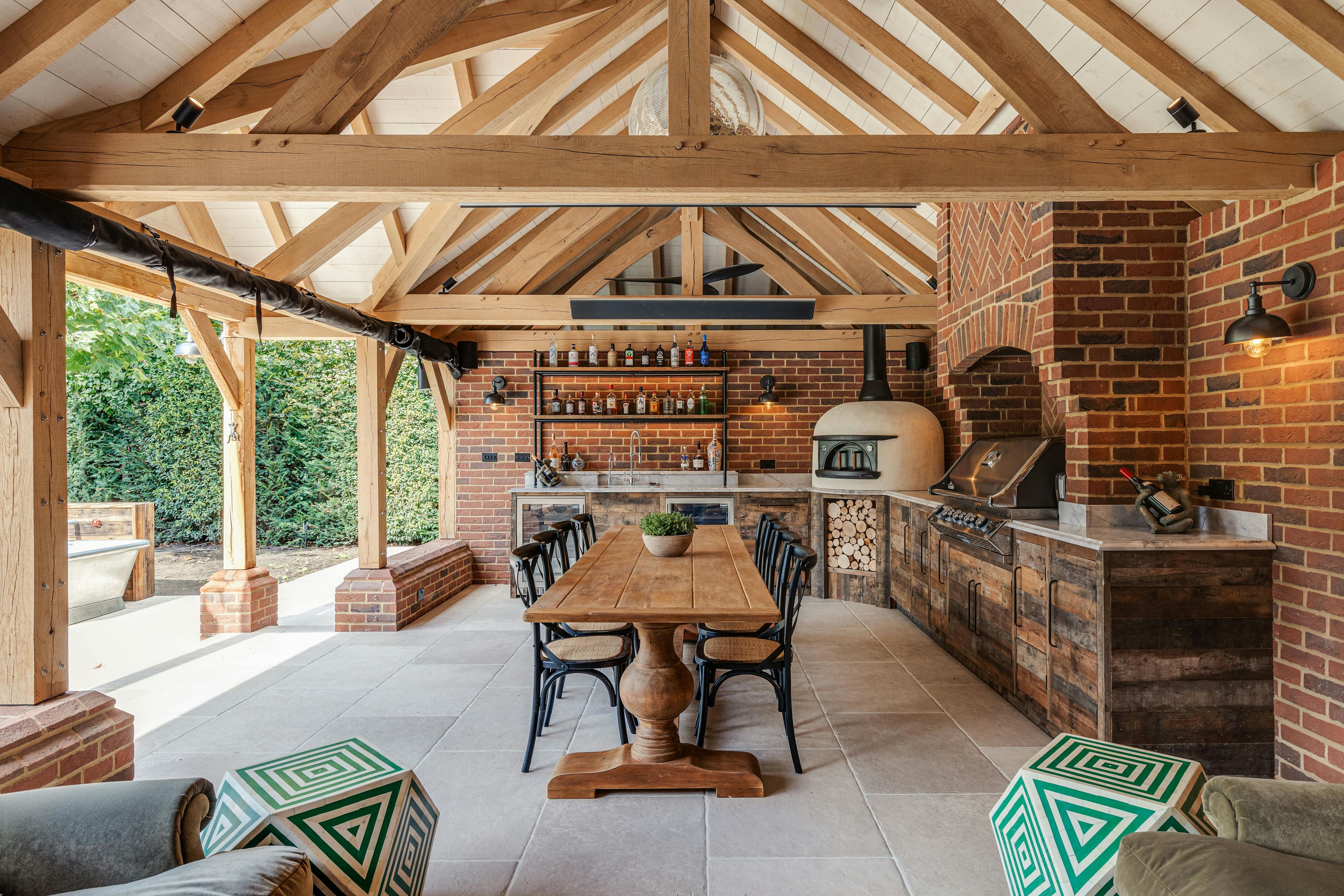 An oak frame outdoor bar and kitchen with dining area