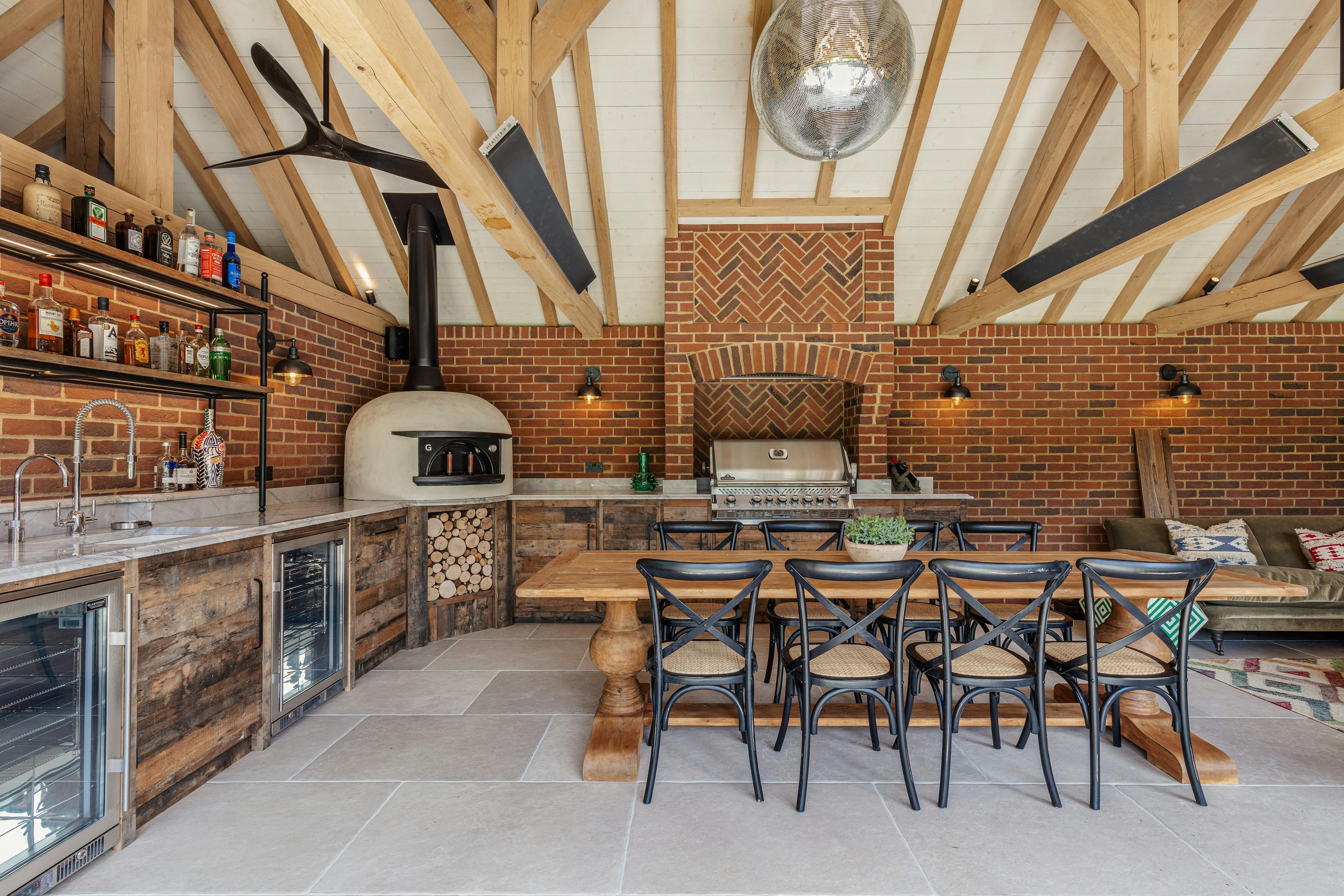 An oak frame outdoor bar and kitchen with dining area