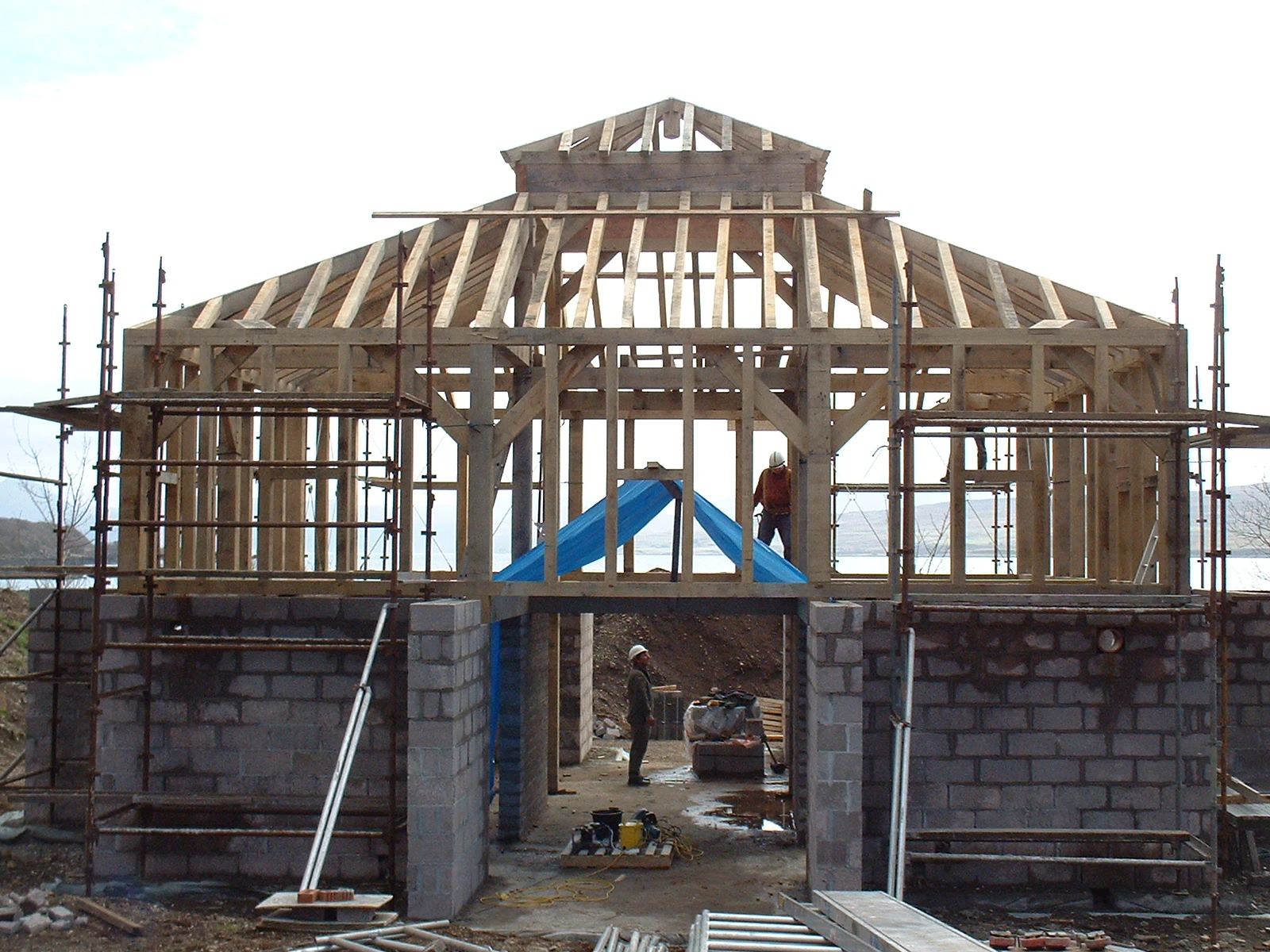 Site installation of a two-story oak-framed home located on the coast