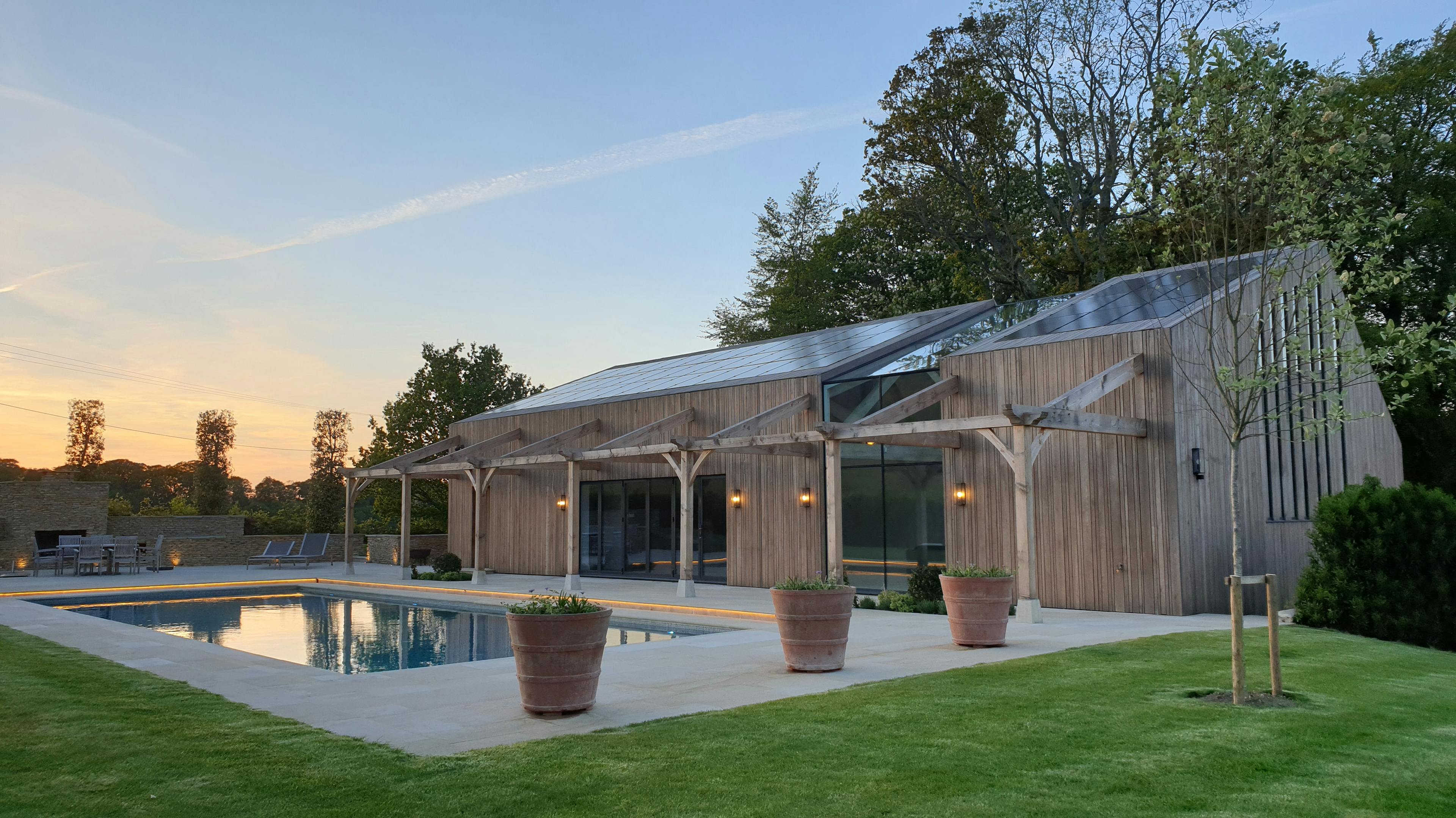 Exterior view of a glulam-framed pool house and Pilates studio