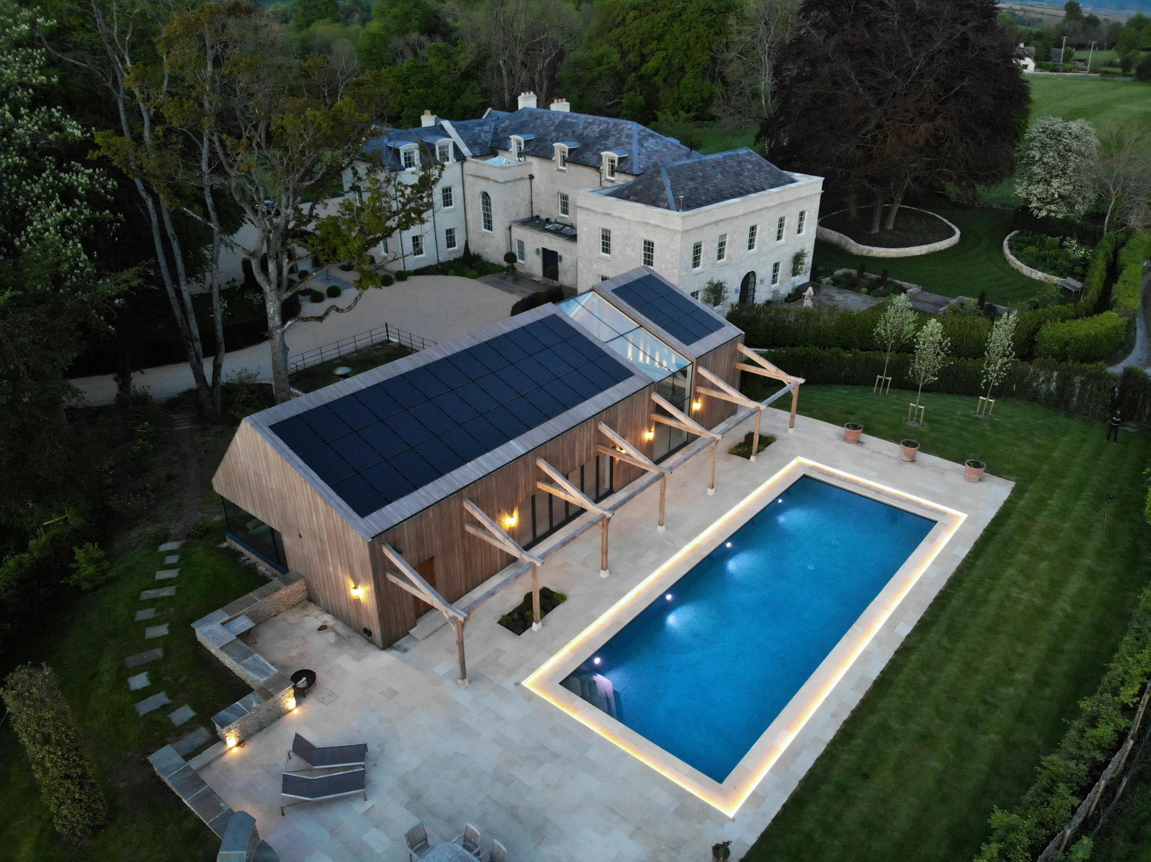 Contemporary glulam-framed pool house and Pilates studio