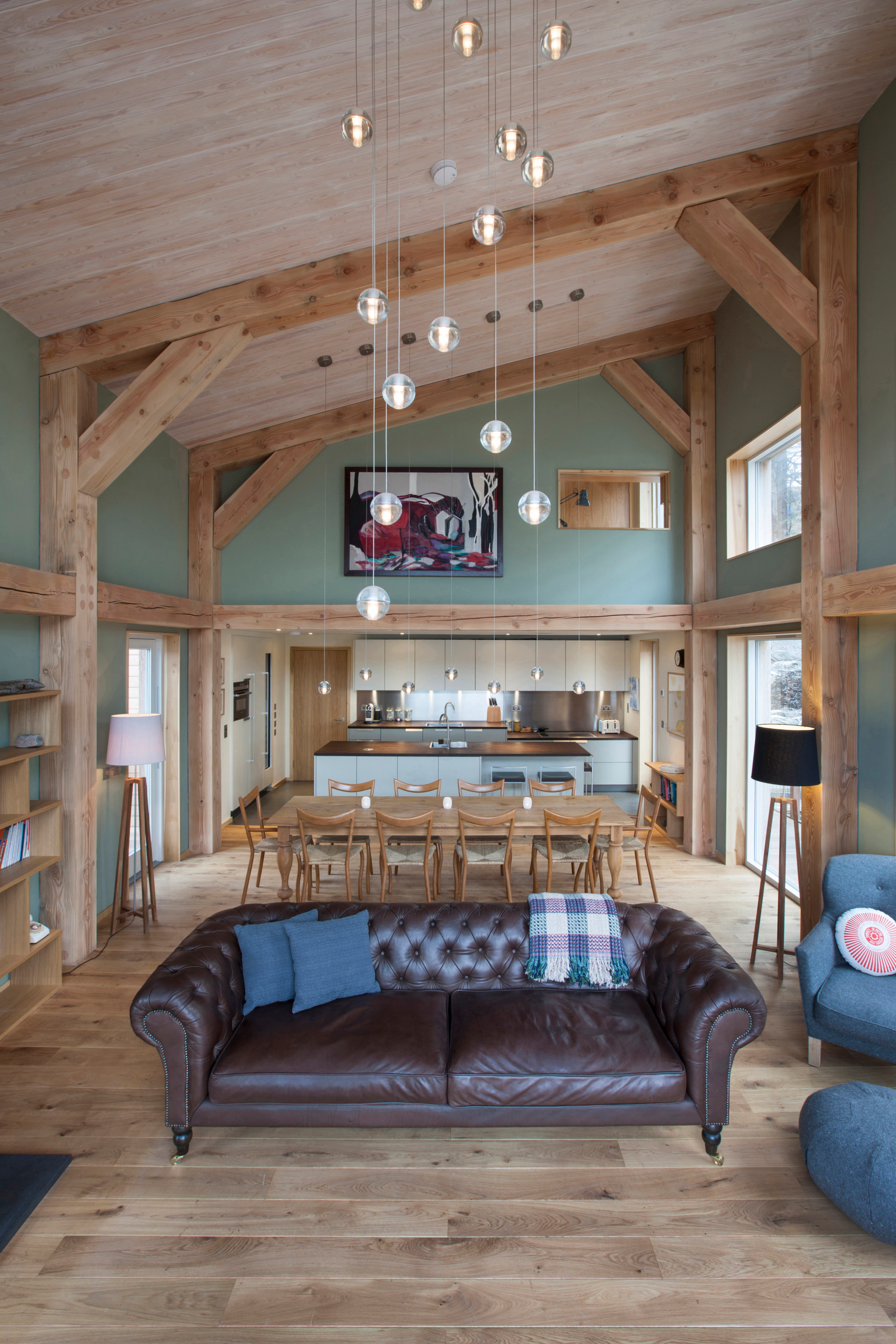 Interior view of an open-plan living space with a Douglas fir frame