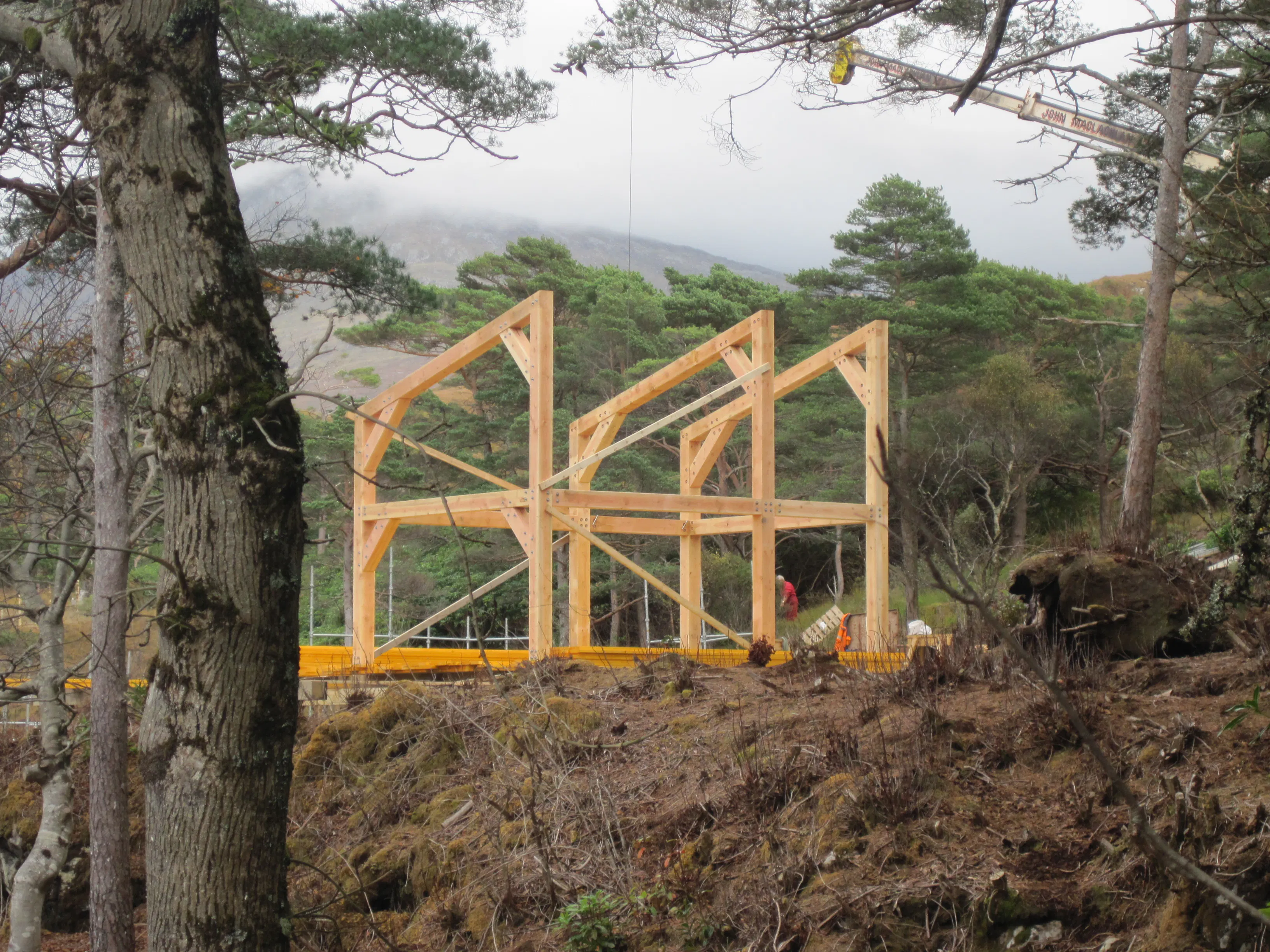 Installing pre-assembled Douglas fir trusses on the shoreline of a loch