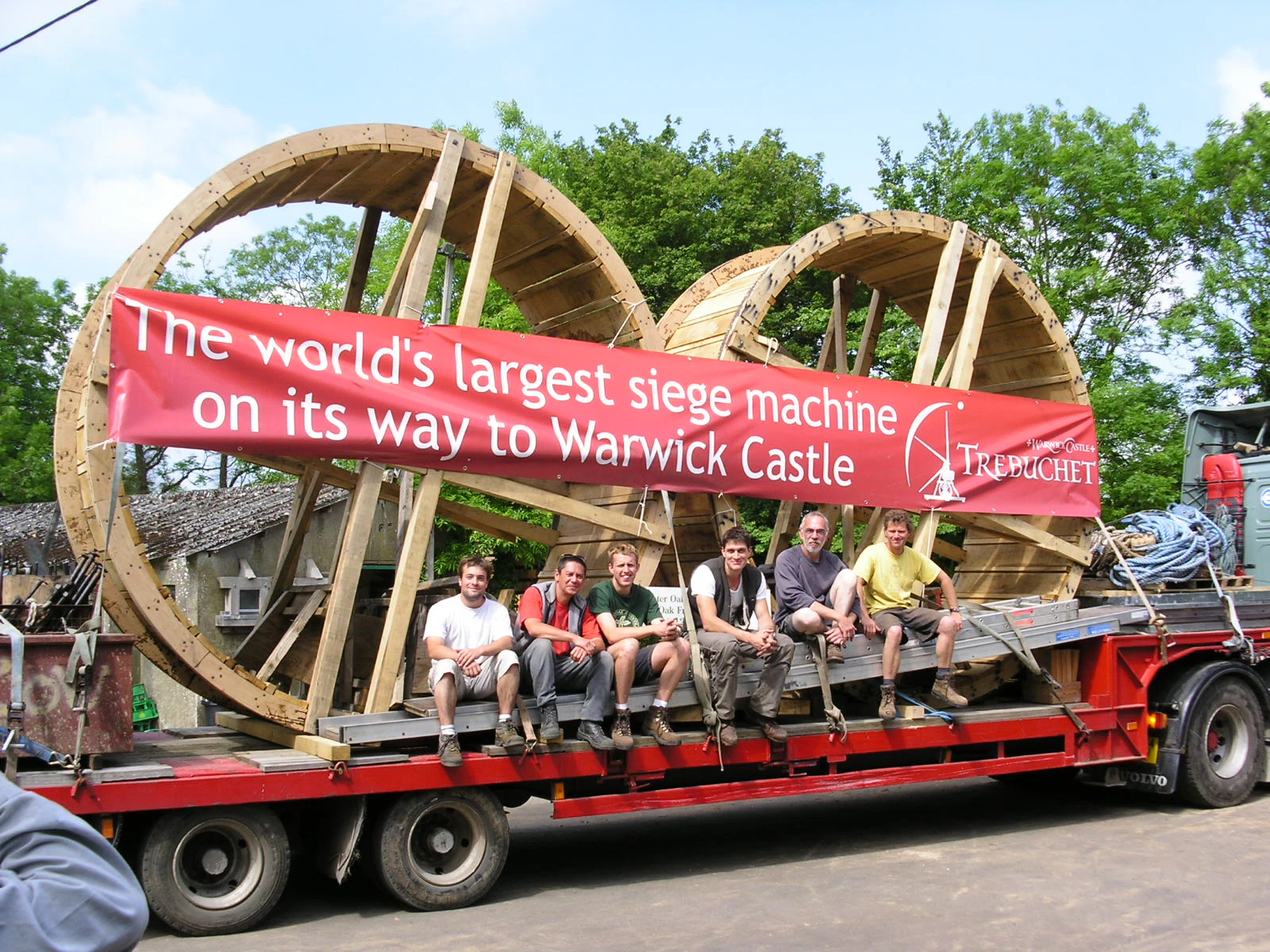 Site team loading trebuchet wheels onto a lorry