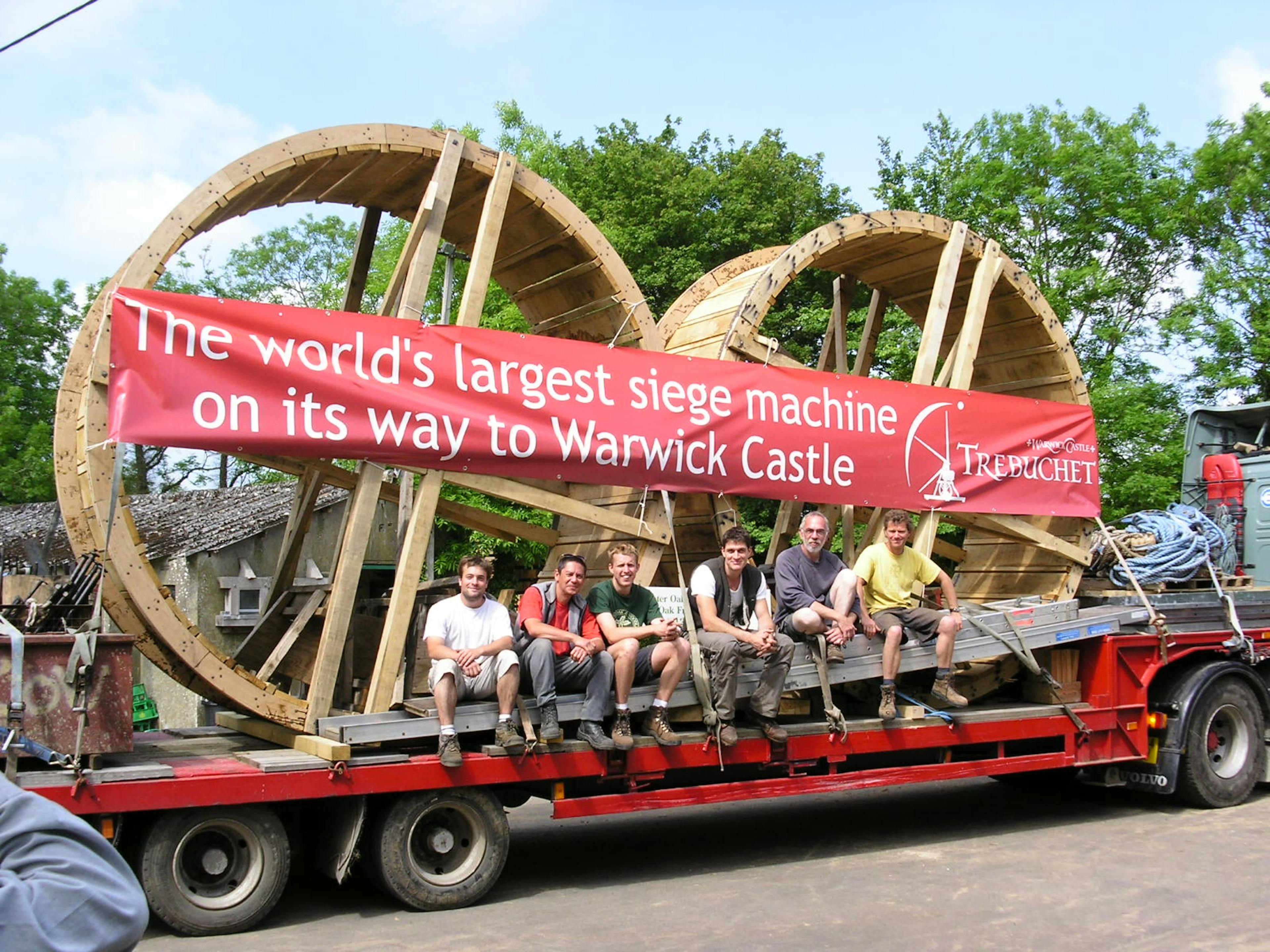 Site team loading trebuchet wheels onto a lorry