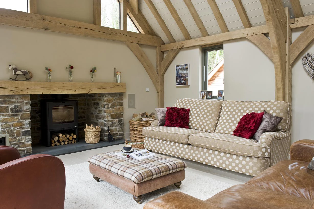 Interior view of an open-plan living space featuring a central fireplace