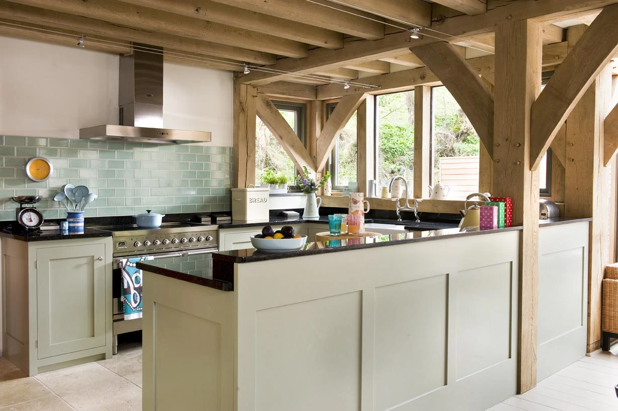 Interior view of an open-plan living space with a farmhouse-style kitchen