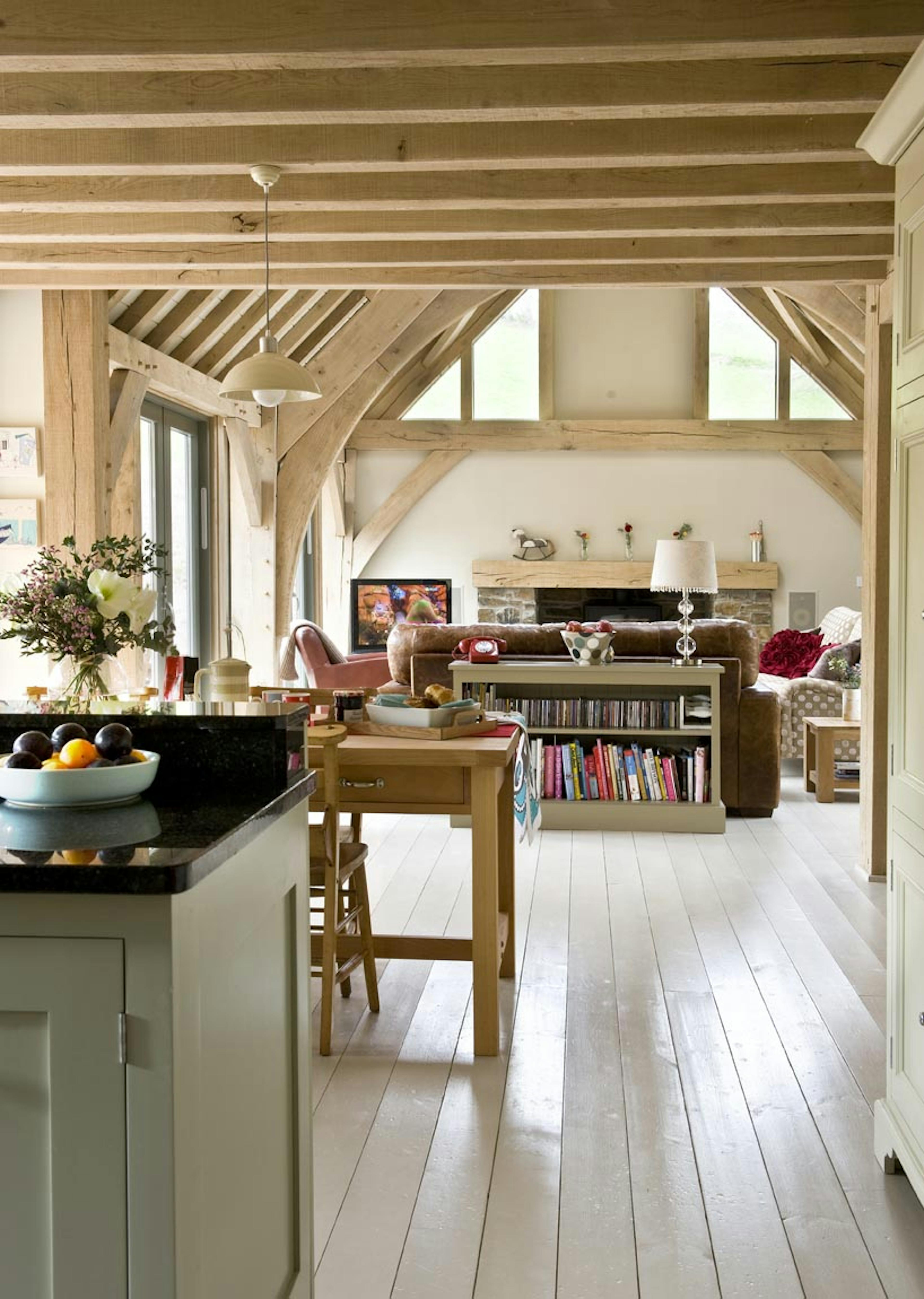 Interior view of an open-plan living space with vaulted ceilings