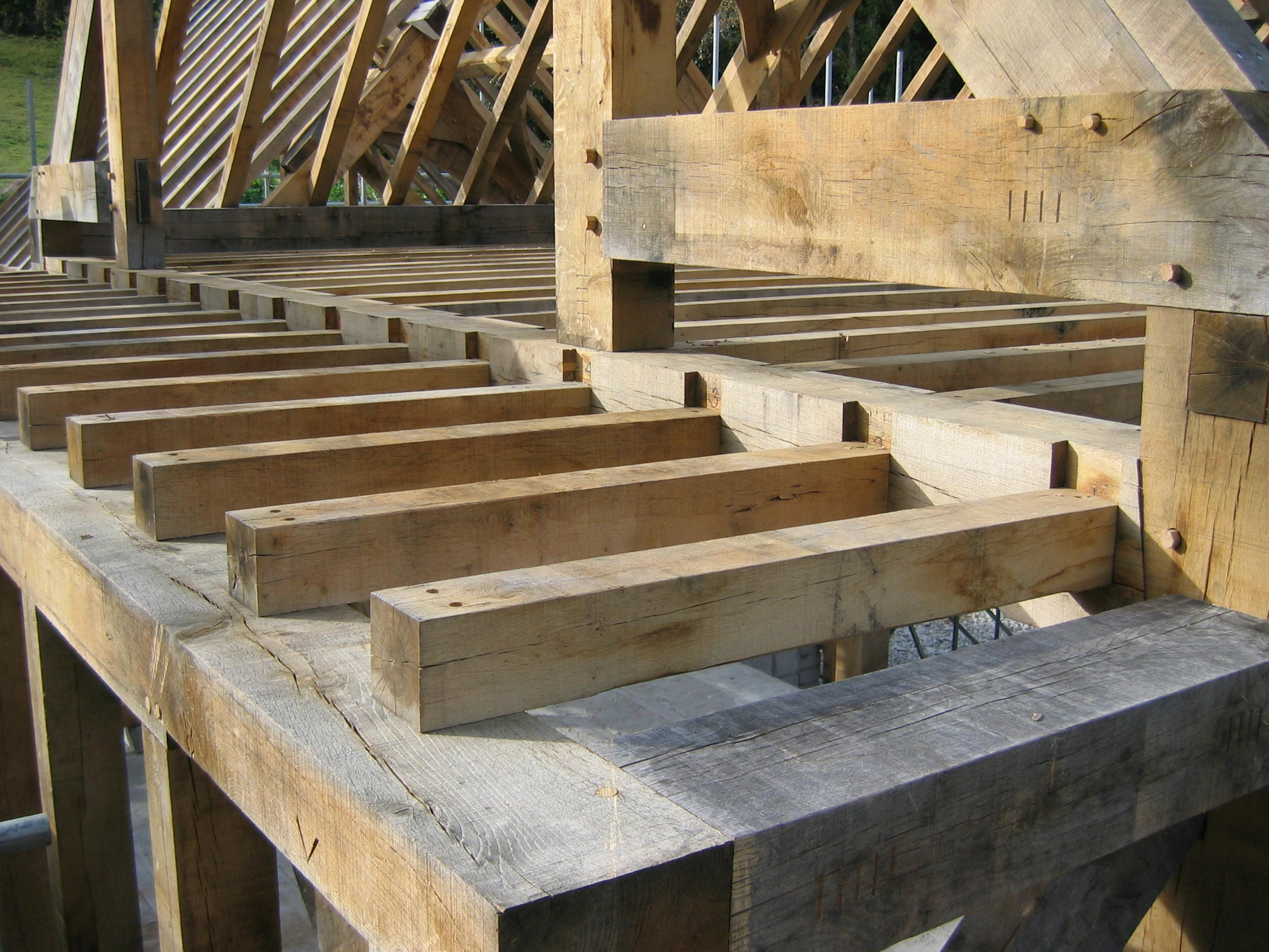 Close-up view of a one-and-a-half-storey oak-framed home being installed on-site
