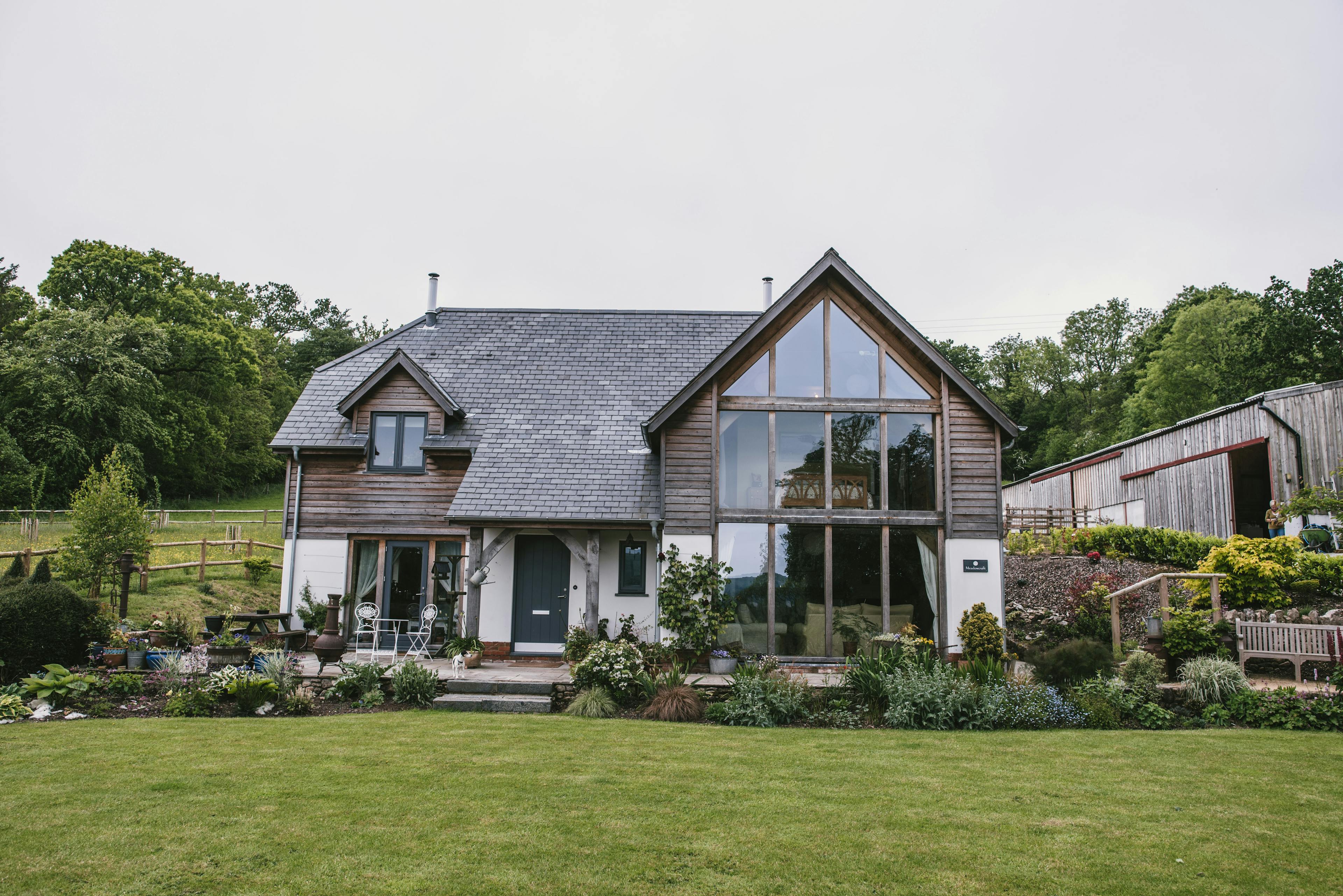 Two-storey oak-framed family home with a large glazed gable end, allowing maximum natural light to flood in