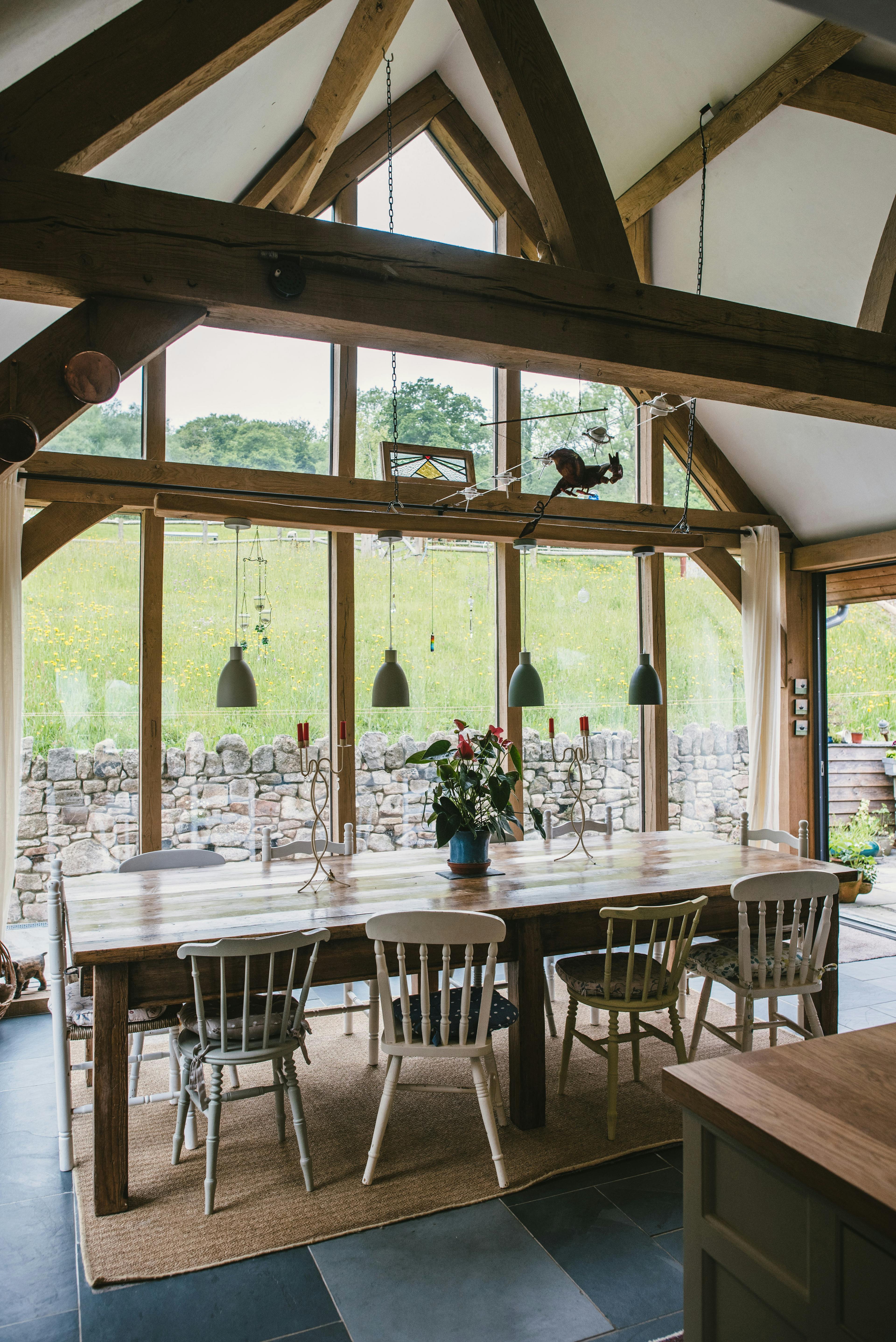 Interior view of a two-storey oak-framed family home featuring a large glazed gable end