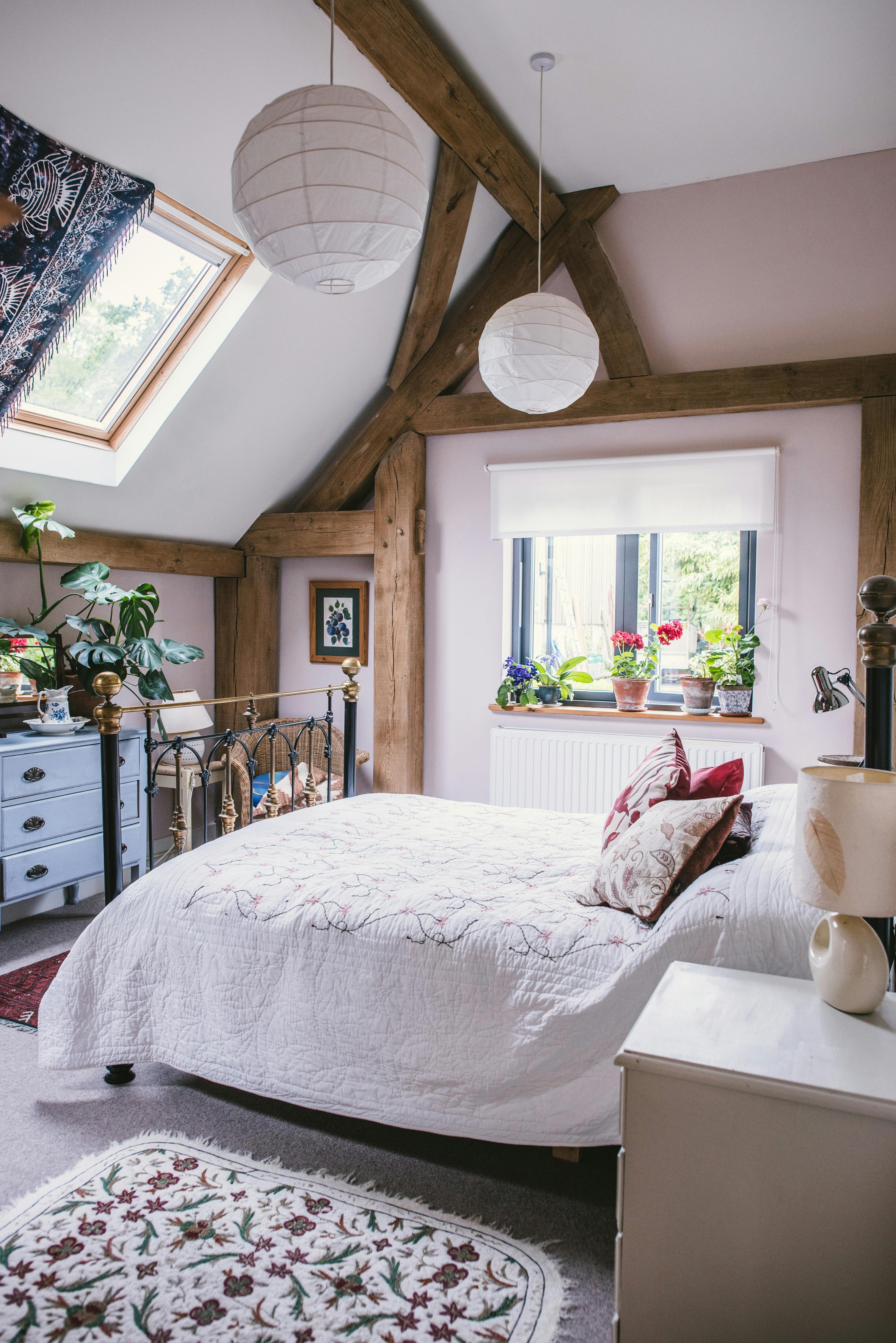 Interior view of a cosy double bedroom in an oak-framed home