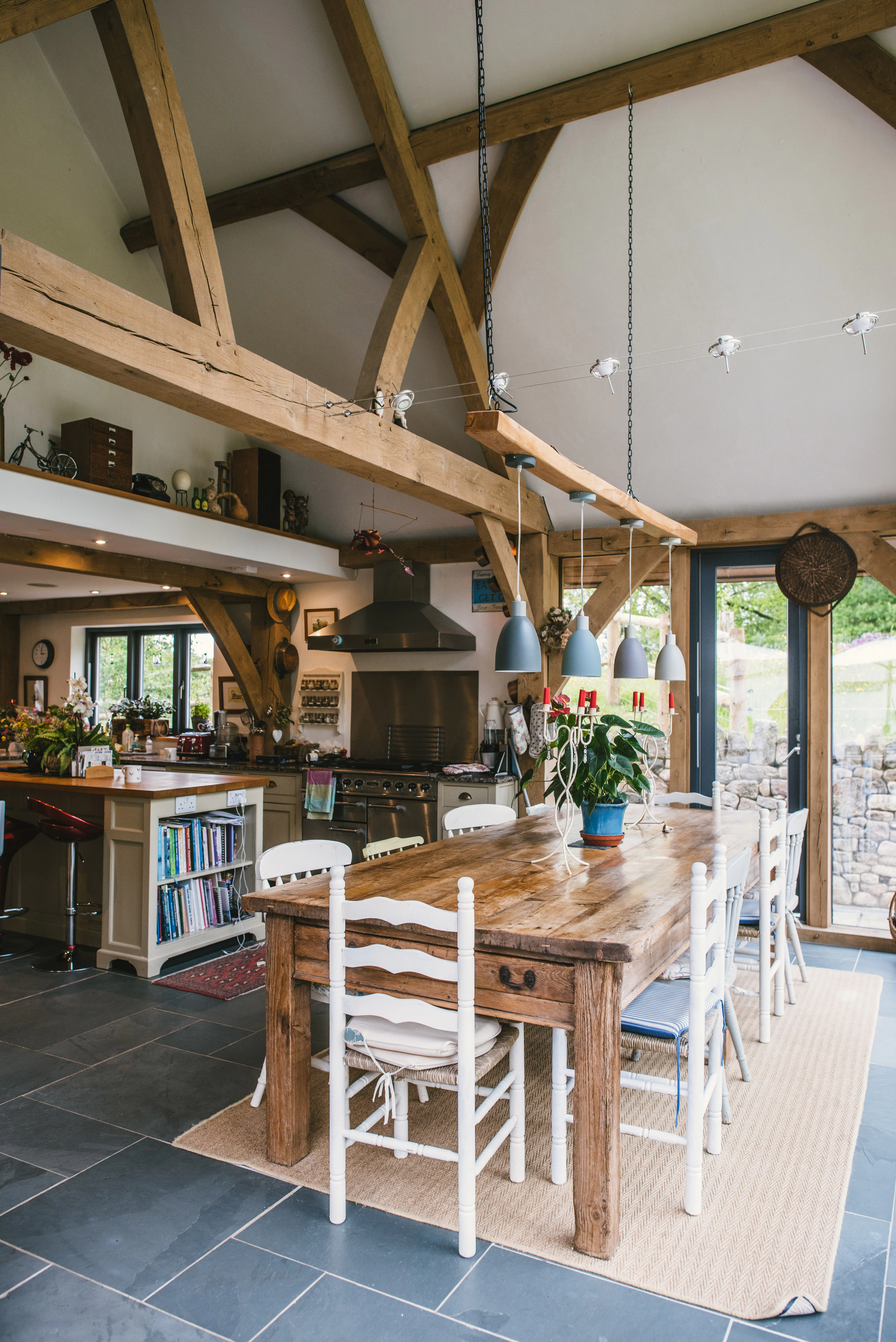 Interior view of a two-storey oak-framed family home with vaulted ceilings and queen post trusses