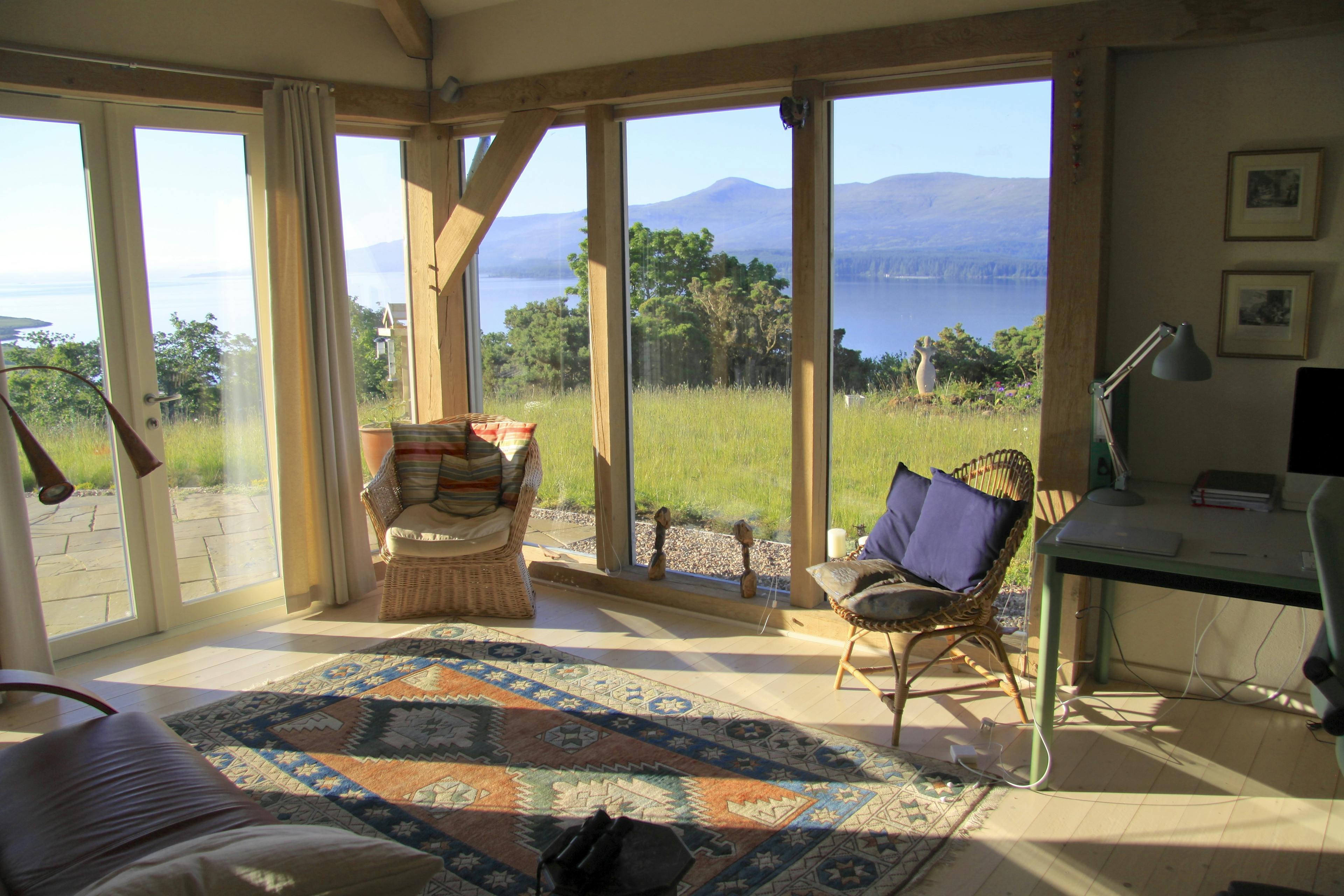 Interior view of a cosy living space inside a curved oak-framed family home