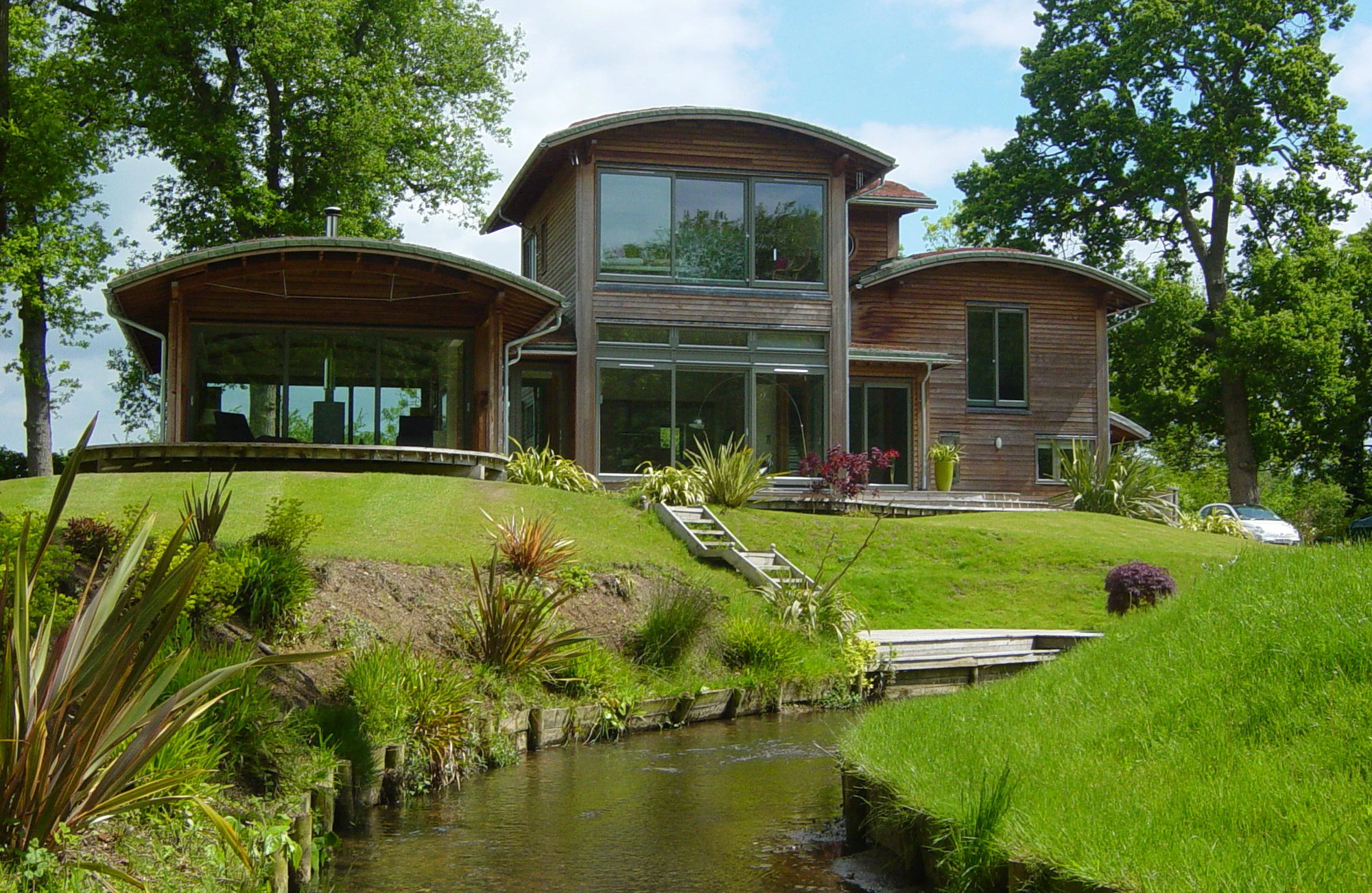 Wrap-Around Garden Surrounding a Douglas Fir-Framed Eco-Friendly Contemporary Home in the Countryside