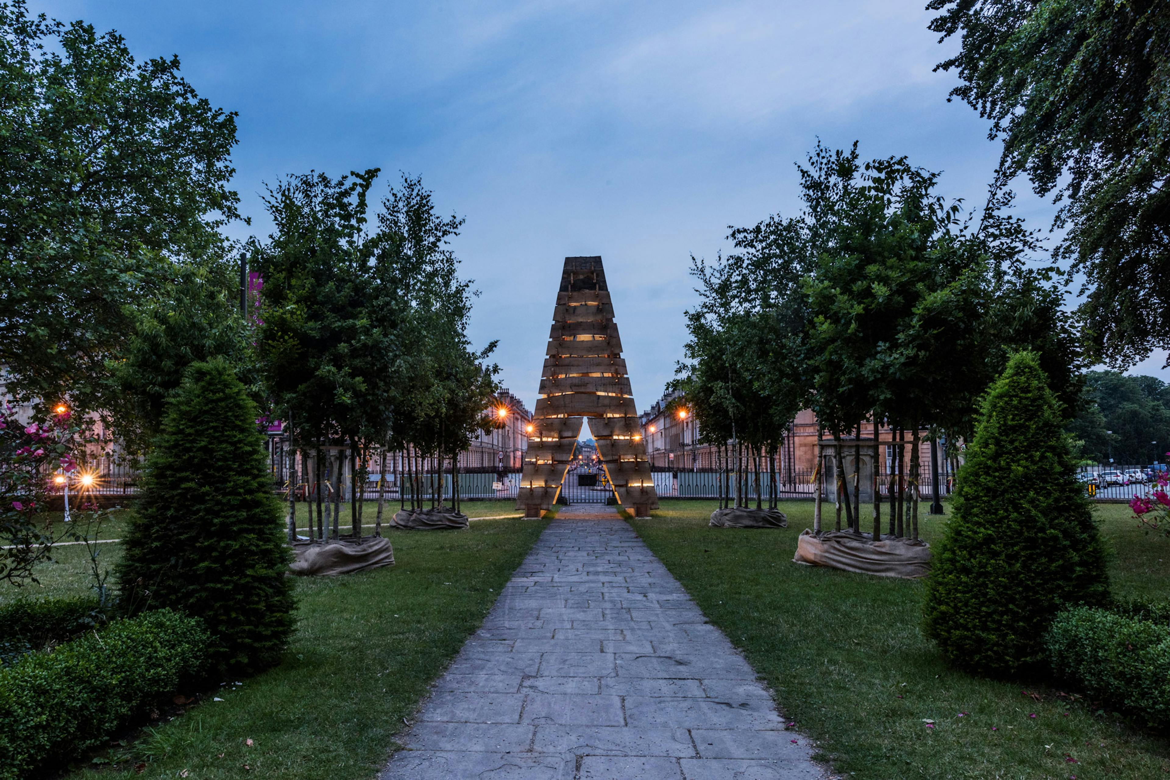 A wooden sculpture for the forest of imagination festival in Bath 2019 at dusk