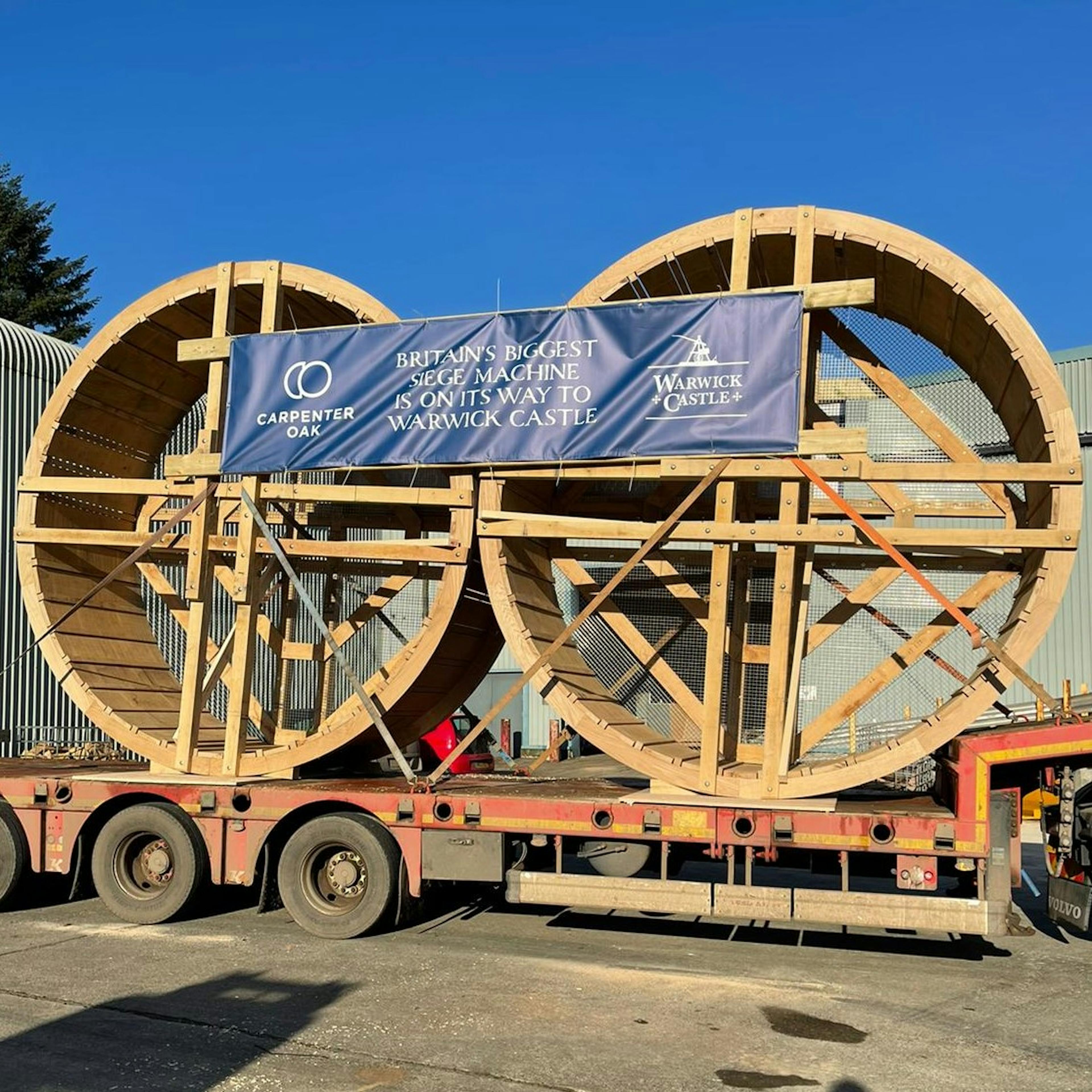 Two wooden wheels for a full scale trebuchet on a lorry