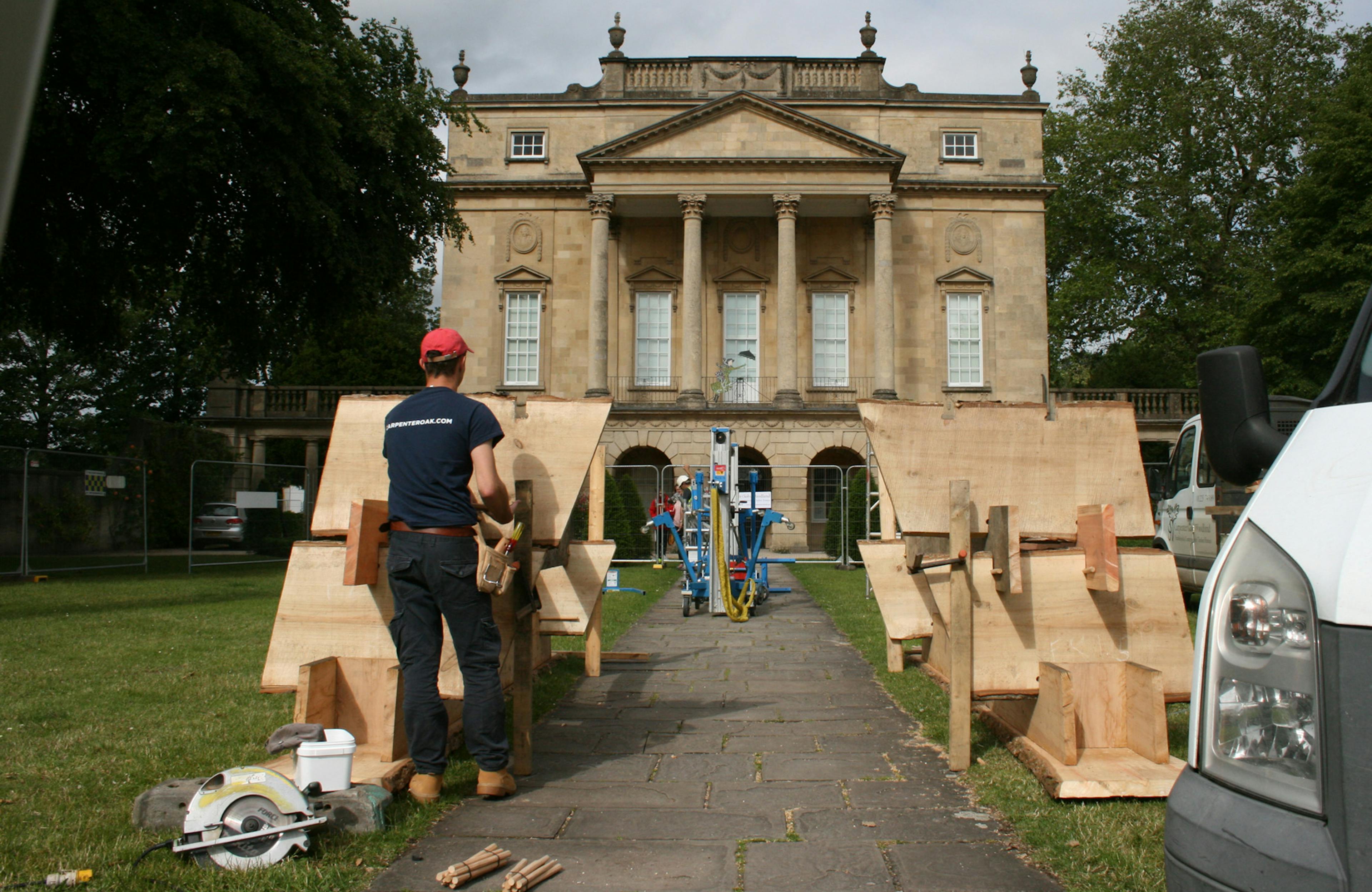 Carpenters install a wooden structure in front of the Holburne Museum for the forest of imagination festival in Bath in 2019