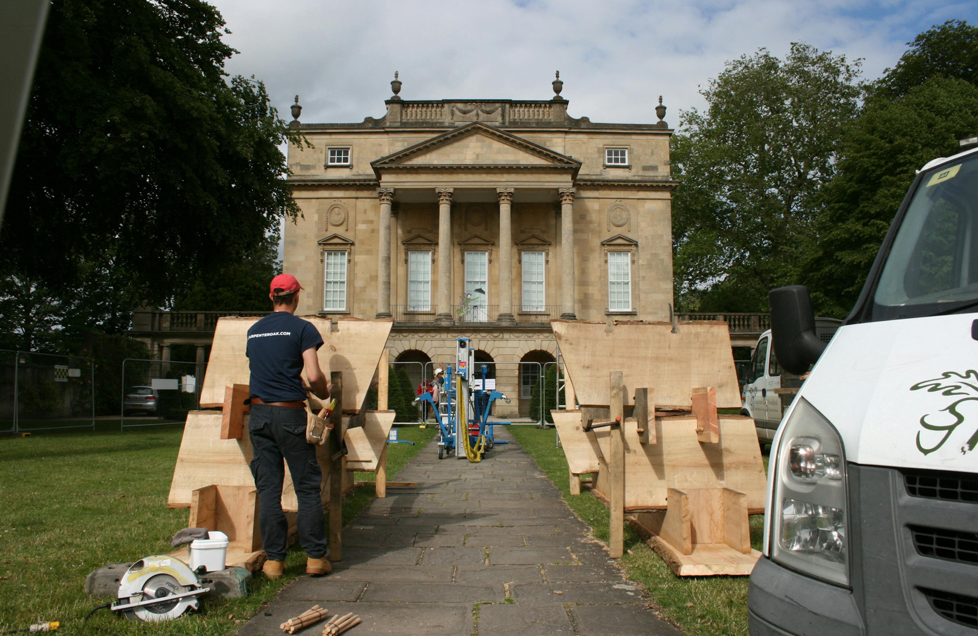 Carpenters install a wooden structure in front of the Holburne Museum for the forest of imagination festival in Bath in 2019