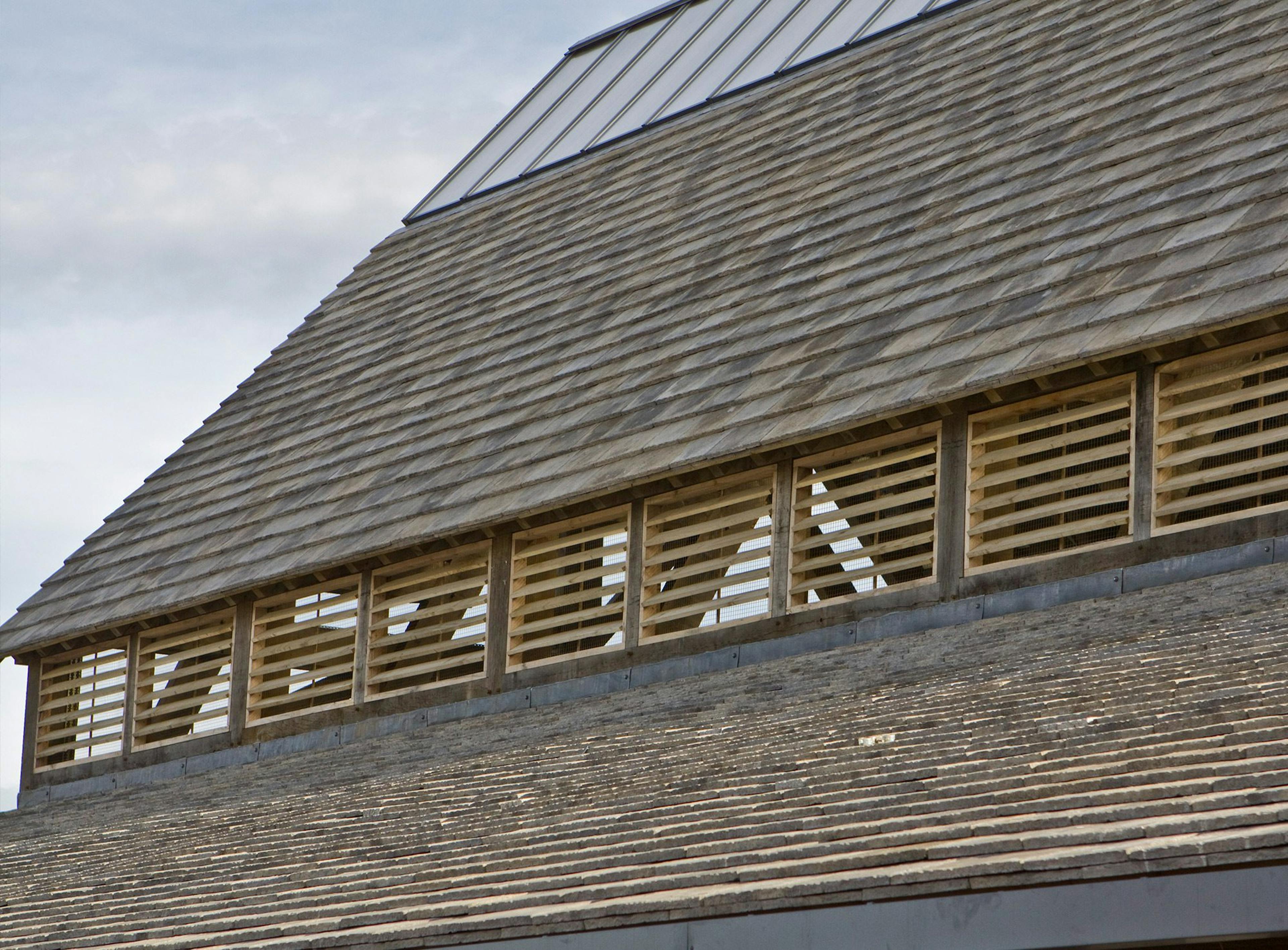 Close-up of roof tiles and wooden window shutters on the Penistone Market timber structure