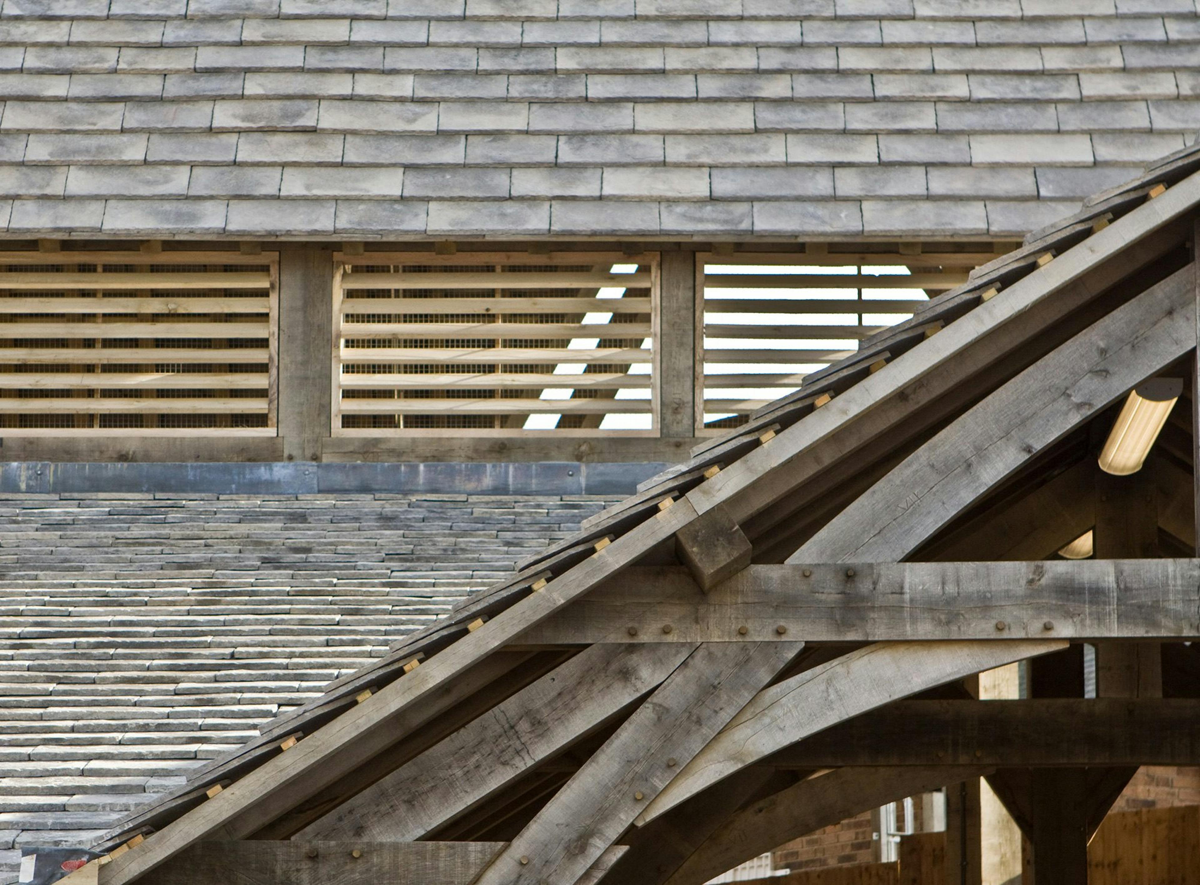 Close-up of roof tiles and wooden window shutters on the Penistone Market structure