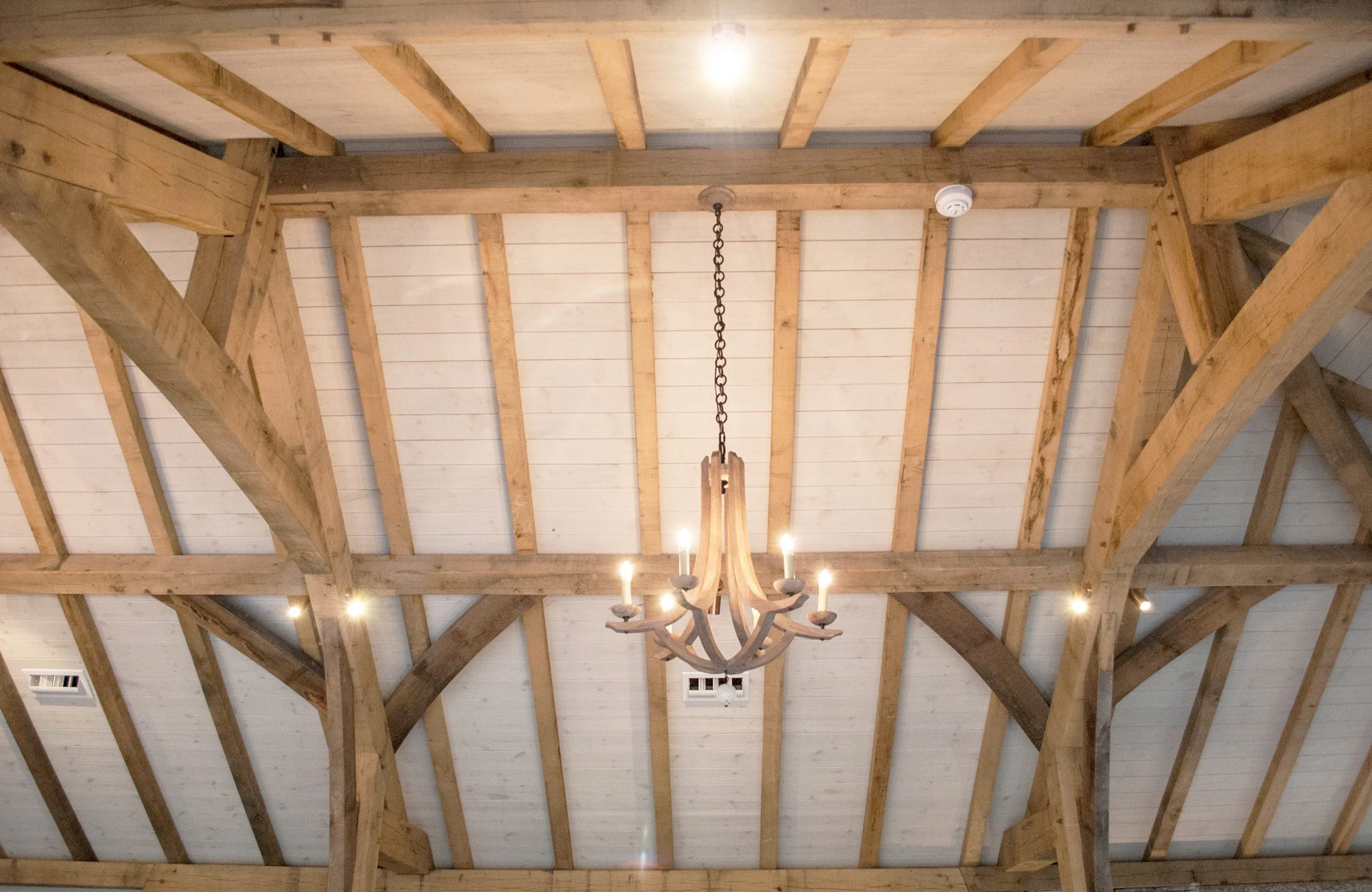Painted softwood boarding inside a structural oak frame