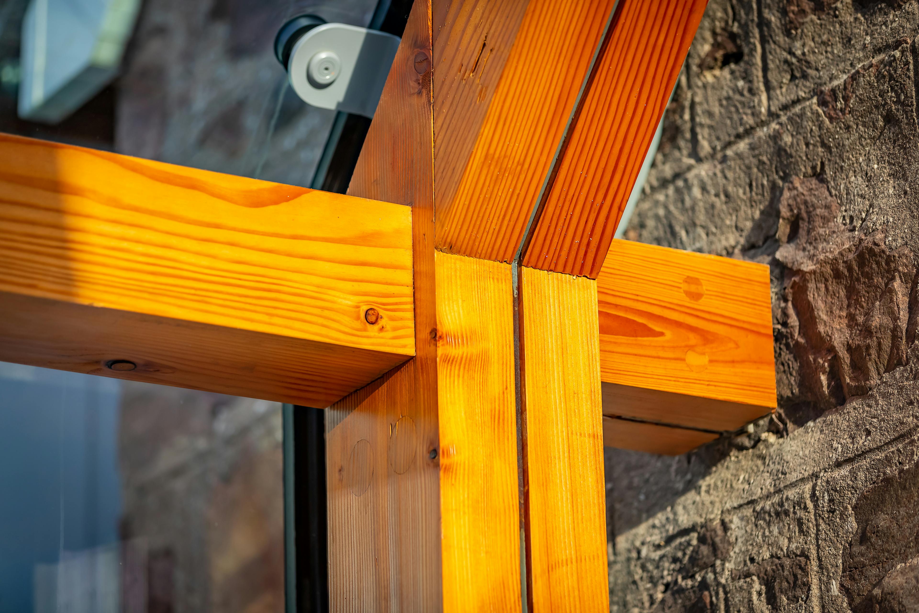 Close-up of a Douglas fir frame surrounded by glazing